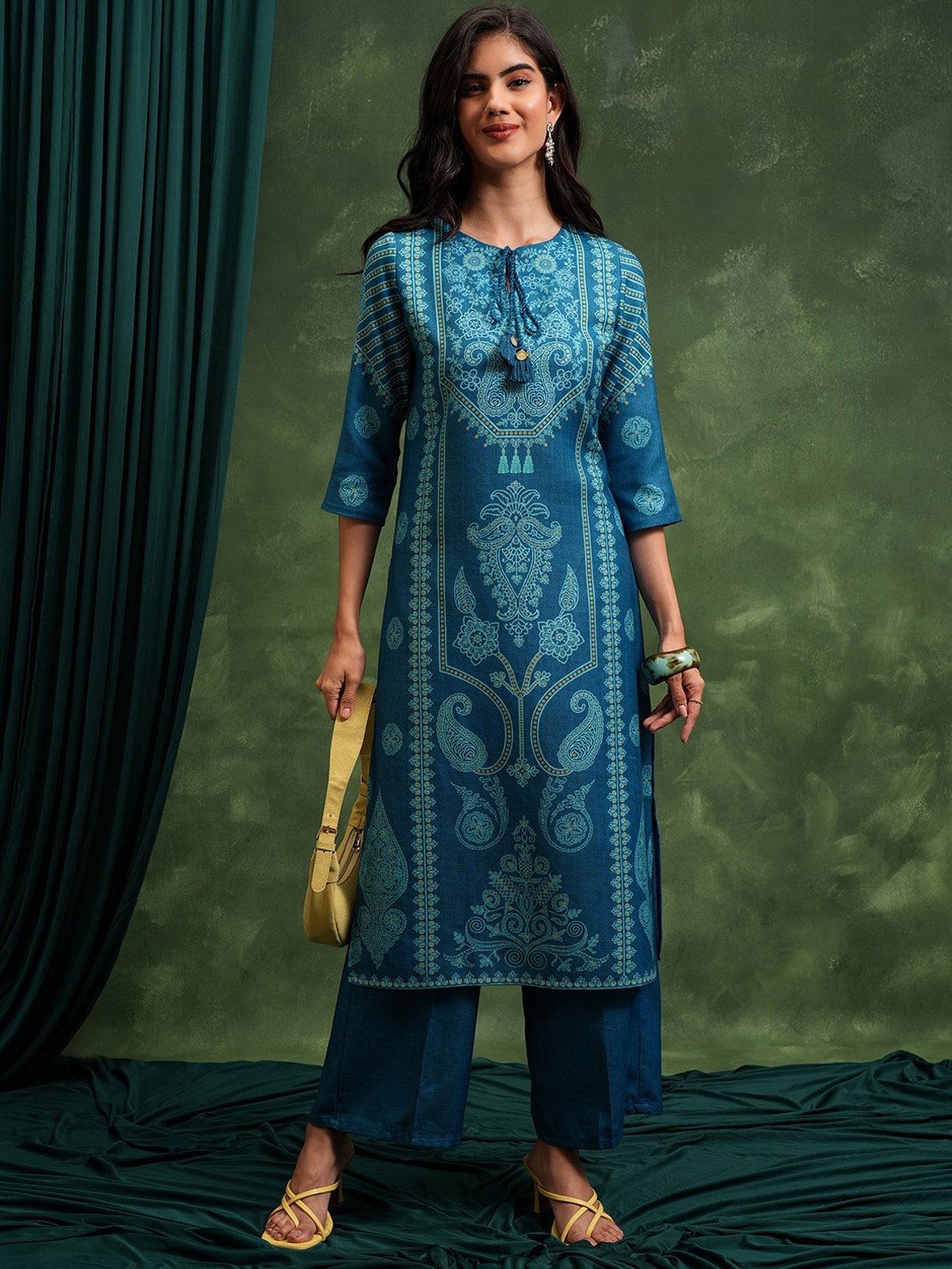 

Vishudh Teal Paisley Printed Tie-Up Neck Straight Kurta with Palazzo