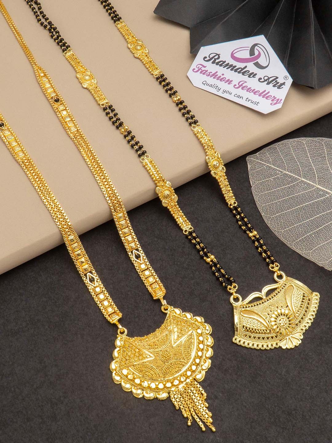 

Ramdev Art Fashion Jwellery Set Of 2 Gold-Plated Stone-Studded & Beaded Mangalsutra