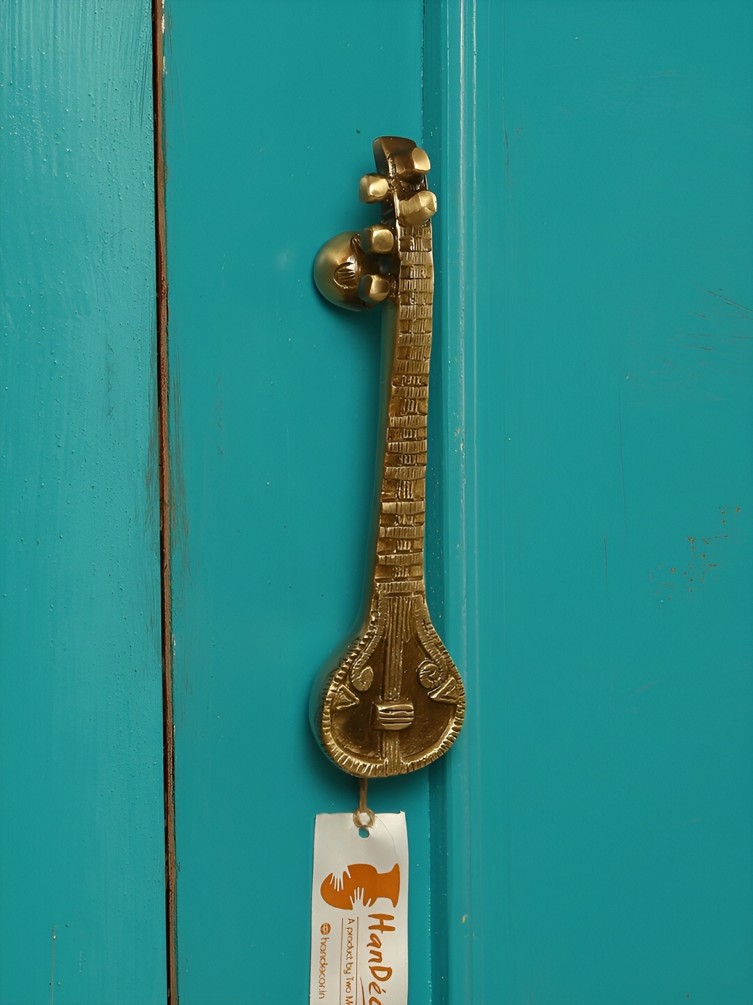 

Two Moustaches Gold Toned Sitar Designed Brass Door Handle