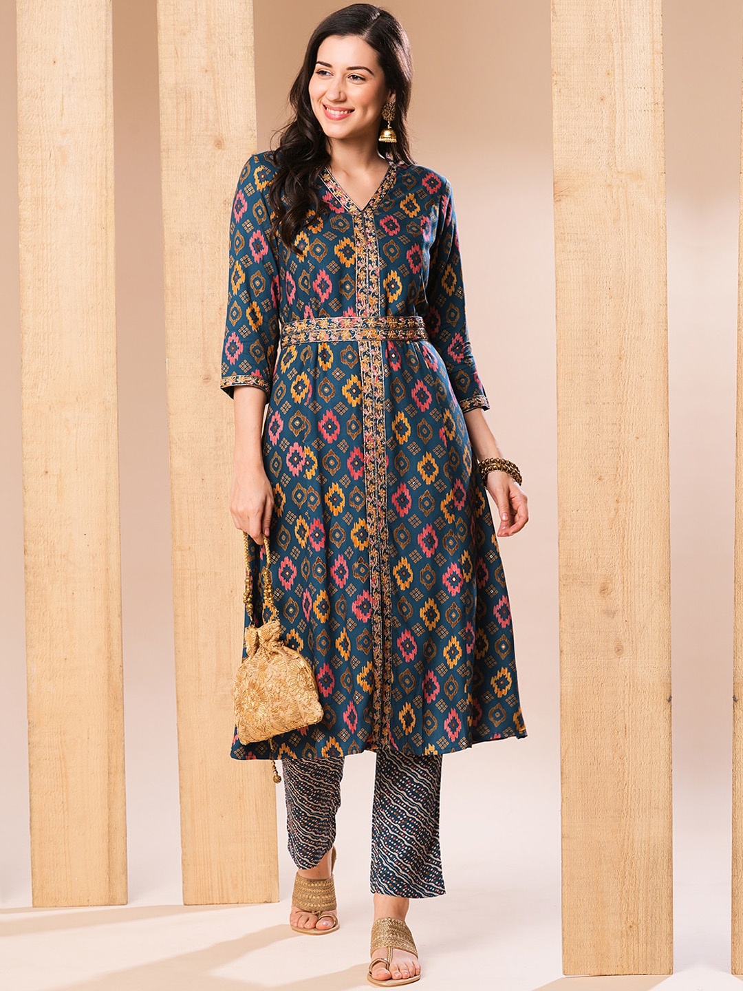

Globus Blue & Orange Ethnic Motifs Printed Regular Thread Work Kurta with Trousers