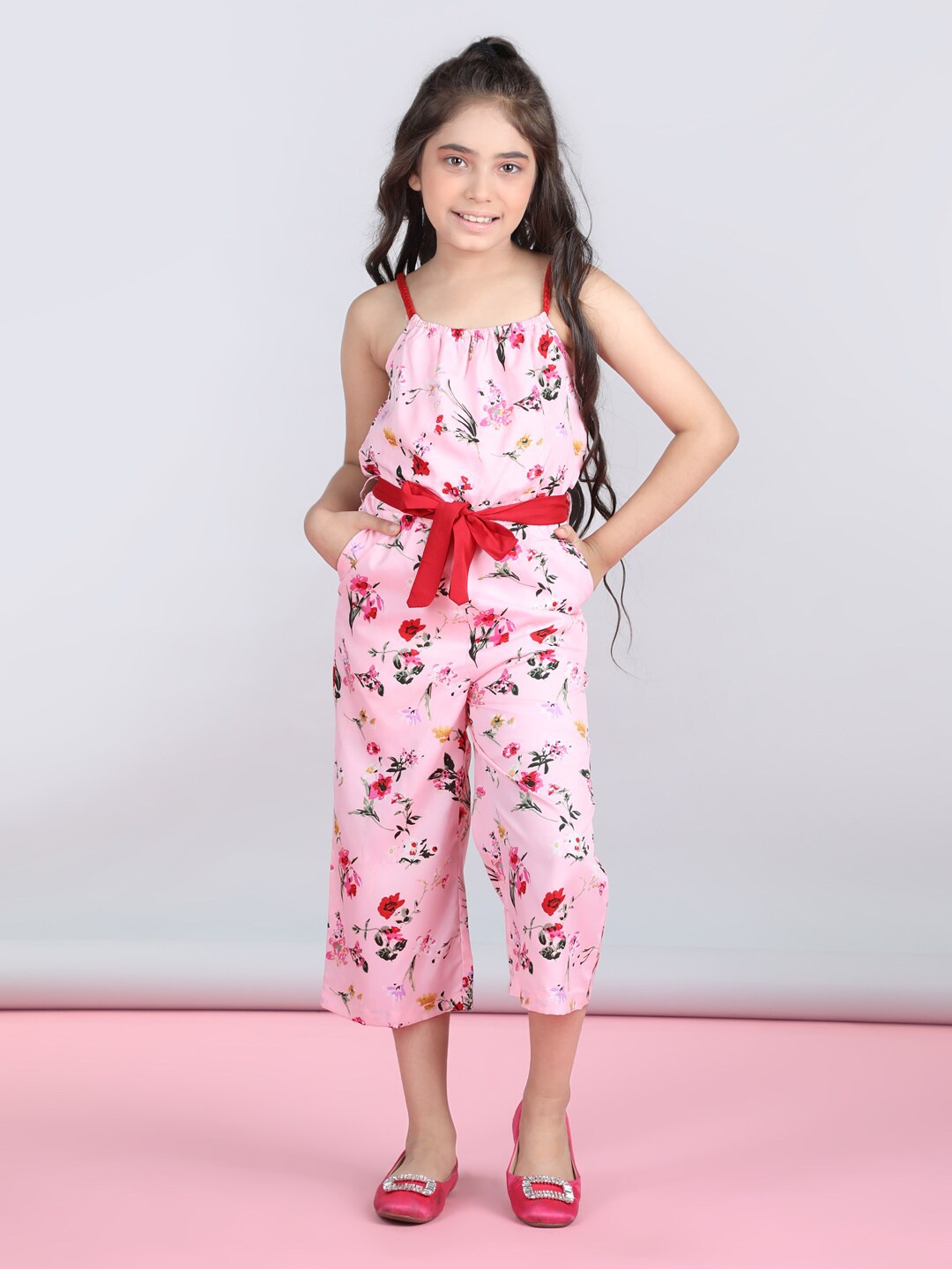 

StyleStone Girls Pink Floral Printed Shoulder Straps Waist Tie Ups Basic Jumpsuit