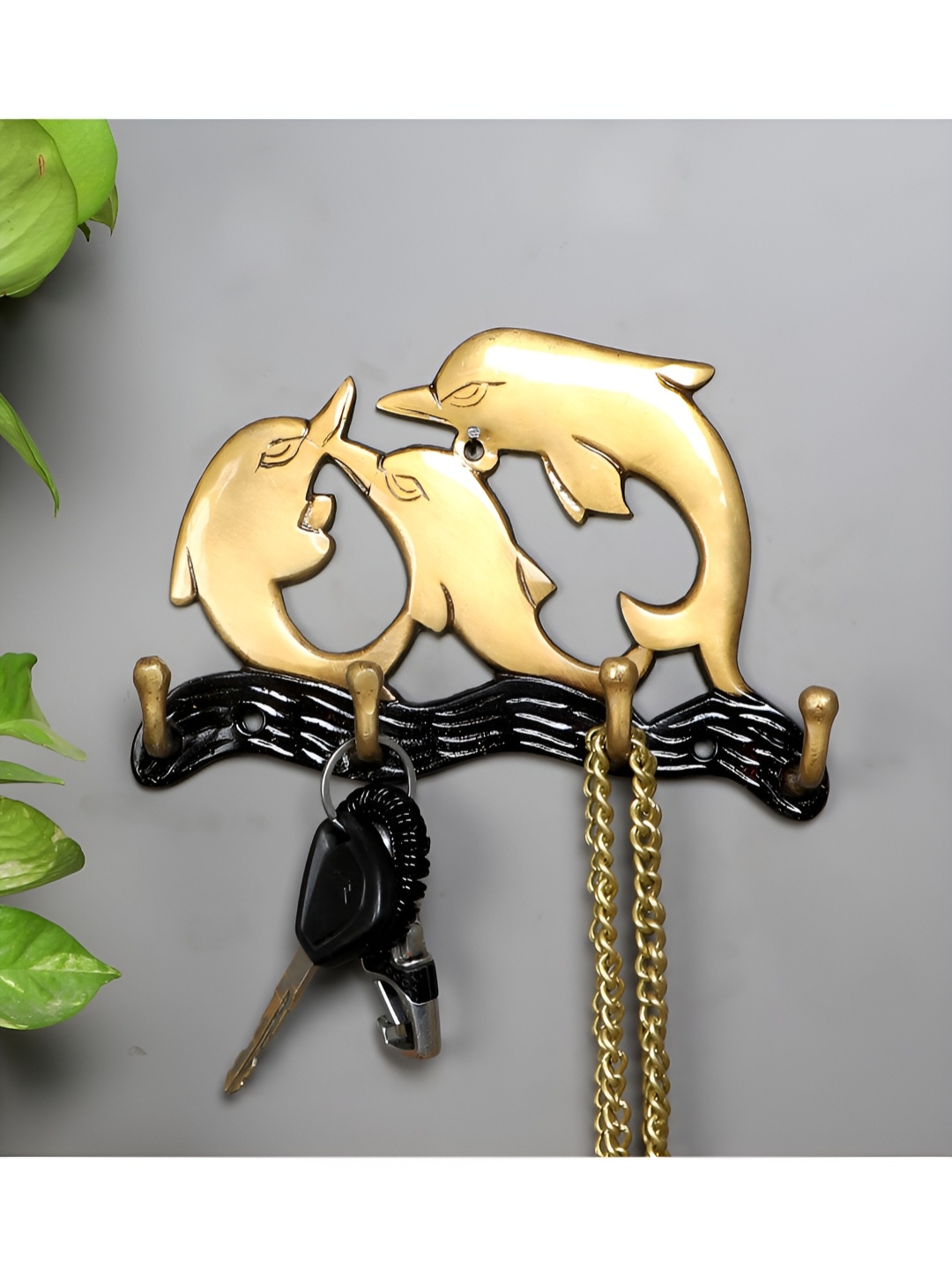 

Two Moustaches Gold Toned & Black Dolphin Family Key Holder