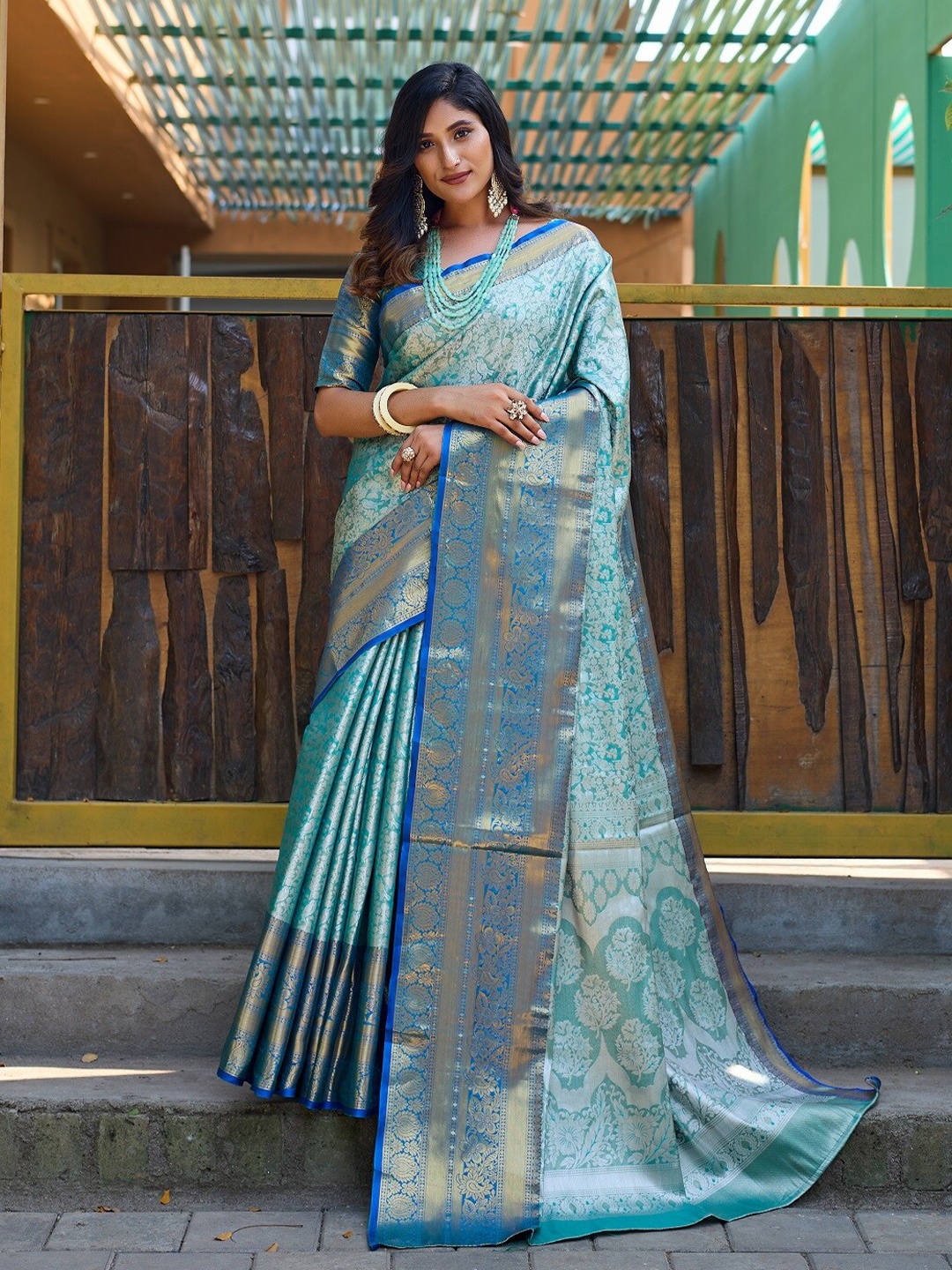 

Anouk Teal Ethnic Motifs Woven Design Zari Silk Blend Kanjeevaram Saree
