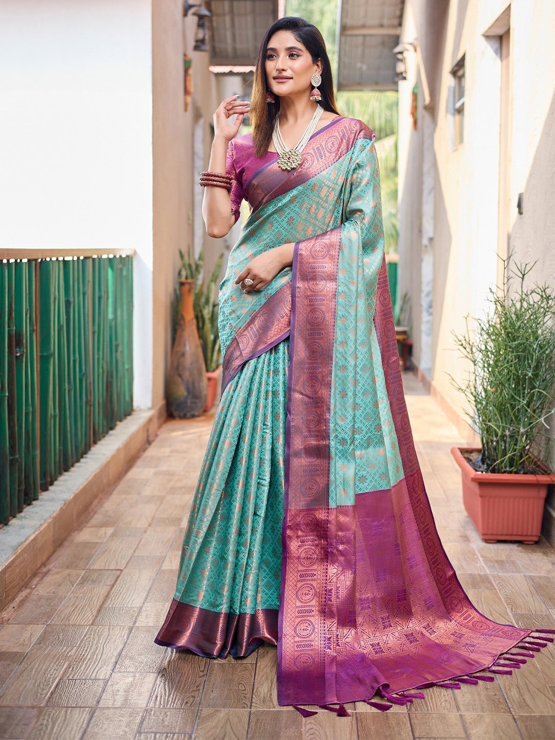 

Anouk Teal Ethnic Motifs Woven Design Zari Silk Blend Kanjeevaram Saree