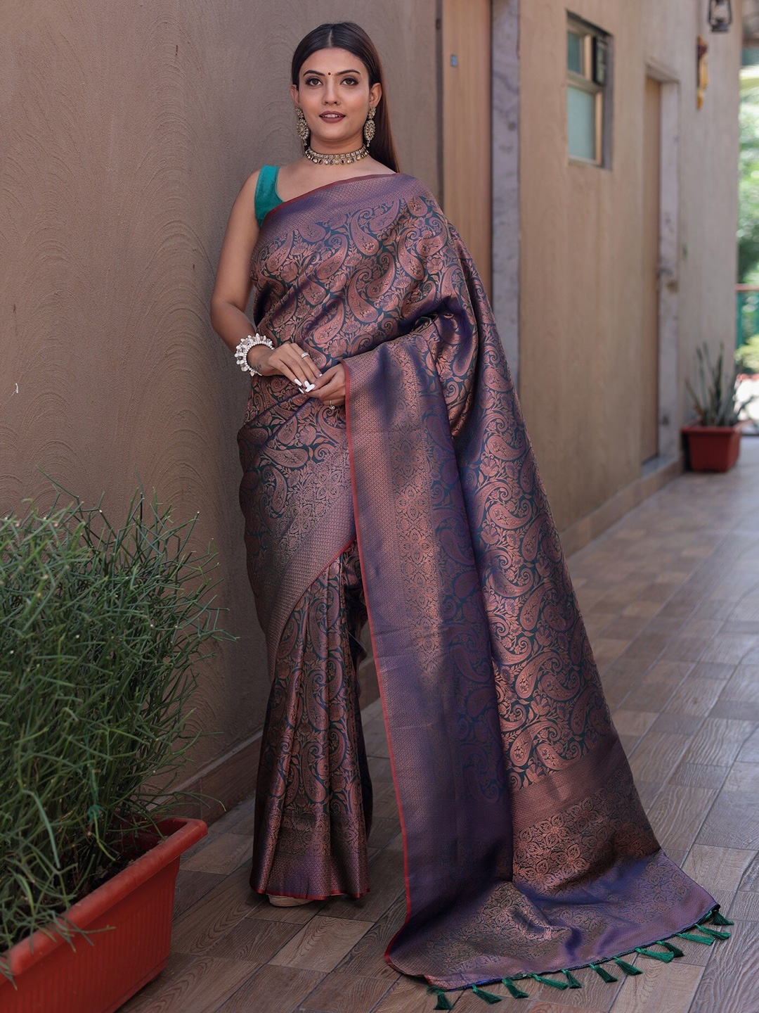 

Anouk Teal Ethnic Motifs Woven Design Zari Silk Blend Kanjeevaram Saree