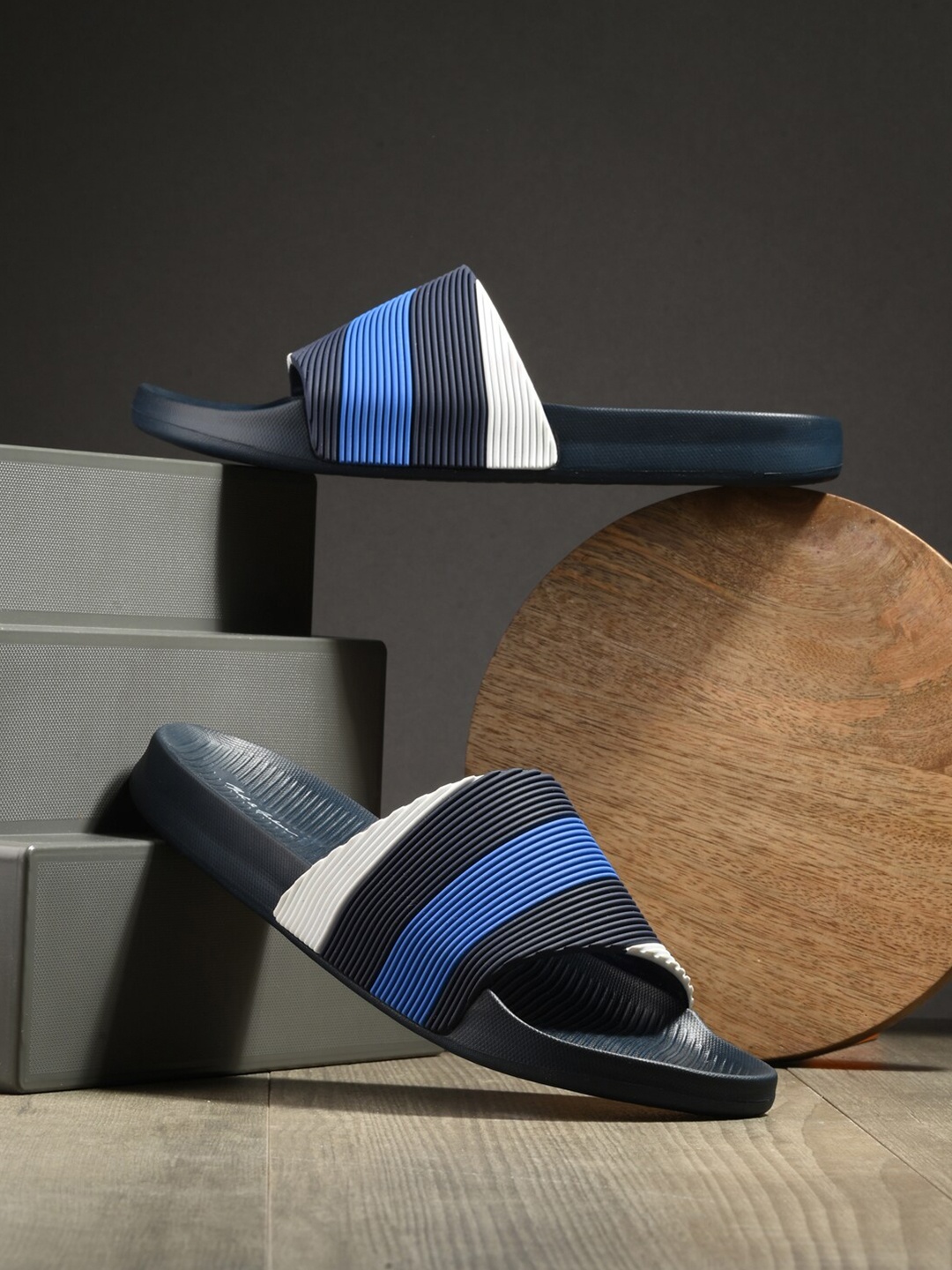 

Mast & Harbour Blue Men Colourblocked Sliders