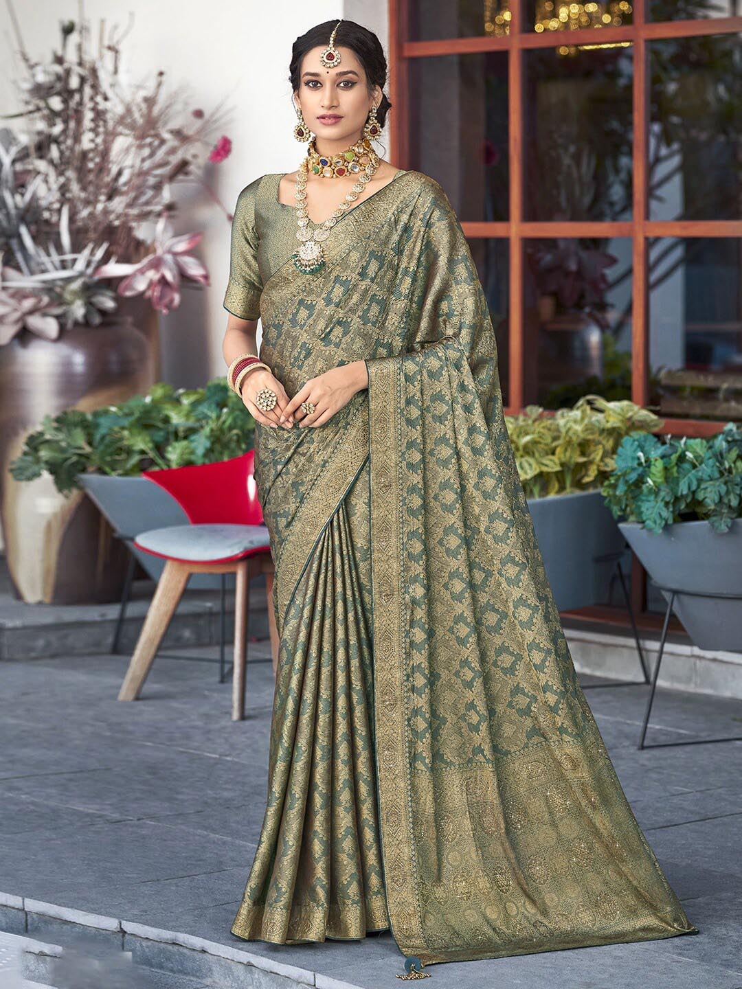 

Satrani Green Ethnic Motifs Woven Design Zari Saree