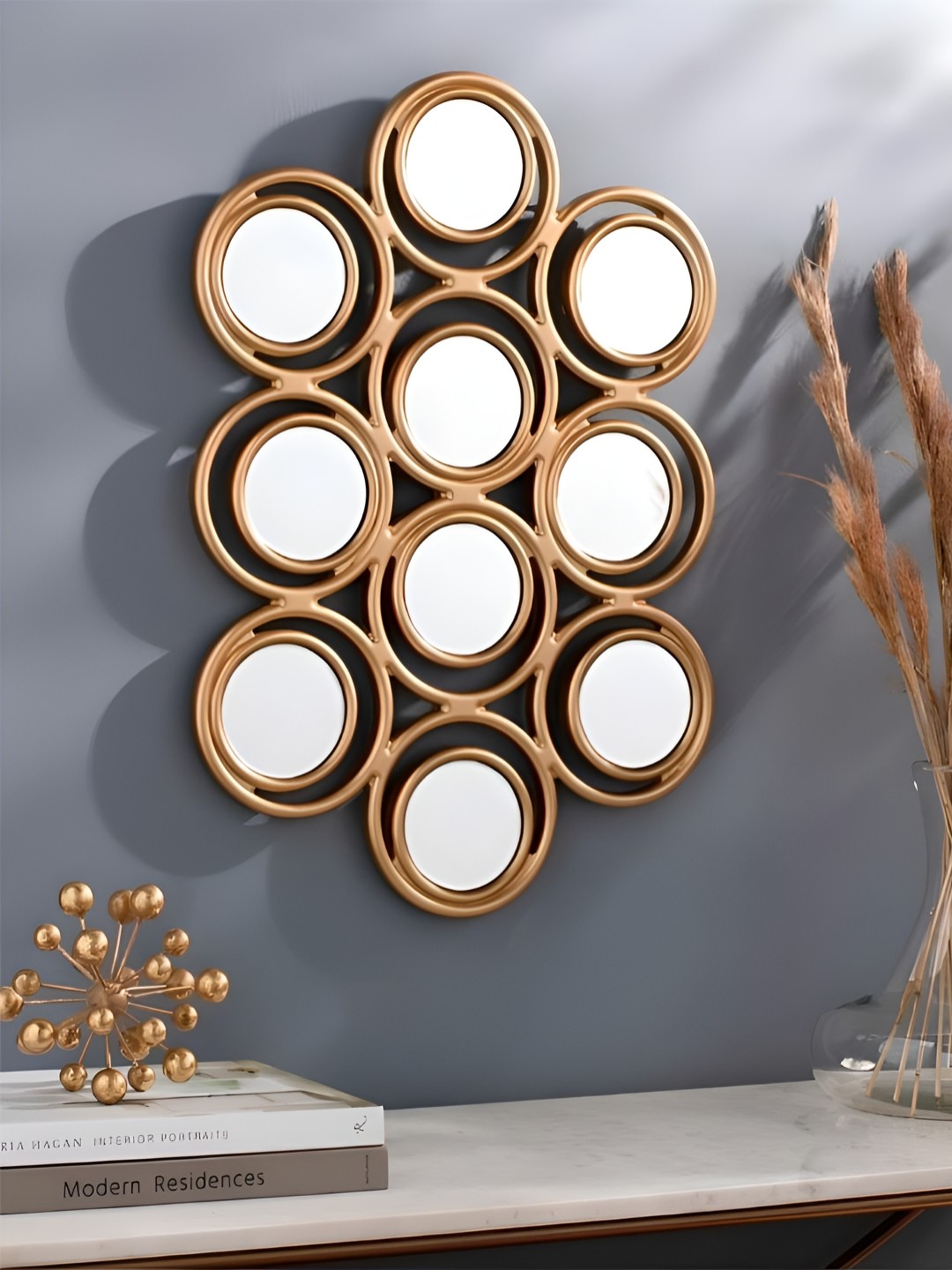 

THE HANDMADE FLAIR Gold Toned Abstract Shaped Wall Mirror