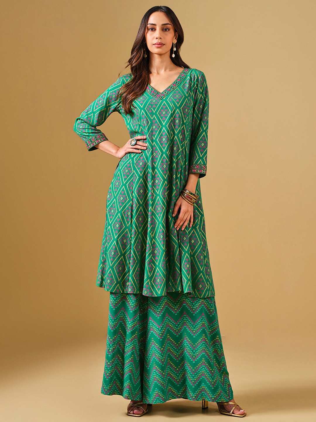 

Global Desi Ethnic Motifs Printed Mirror Work Detailed Panelled A-Line Kurta With Palazzo, Green