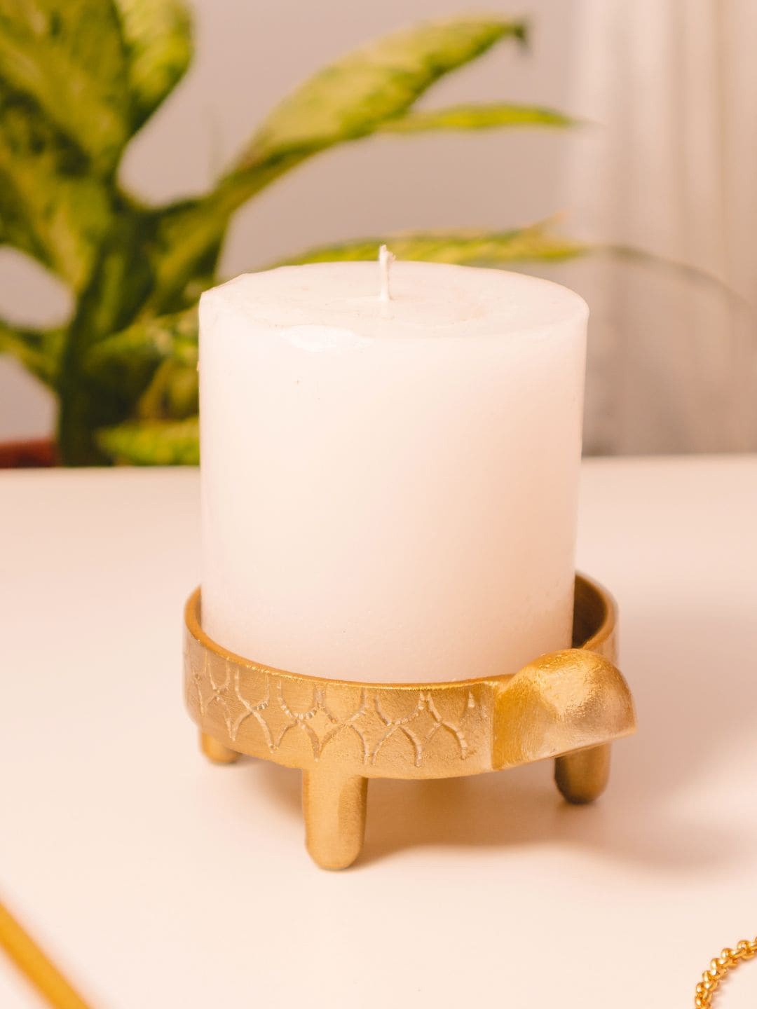

Chokhat Gold Toned Kurma Candle Holder