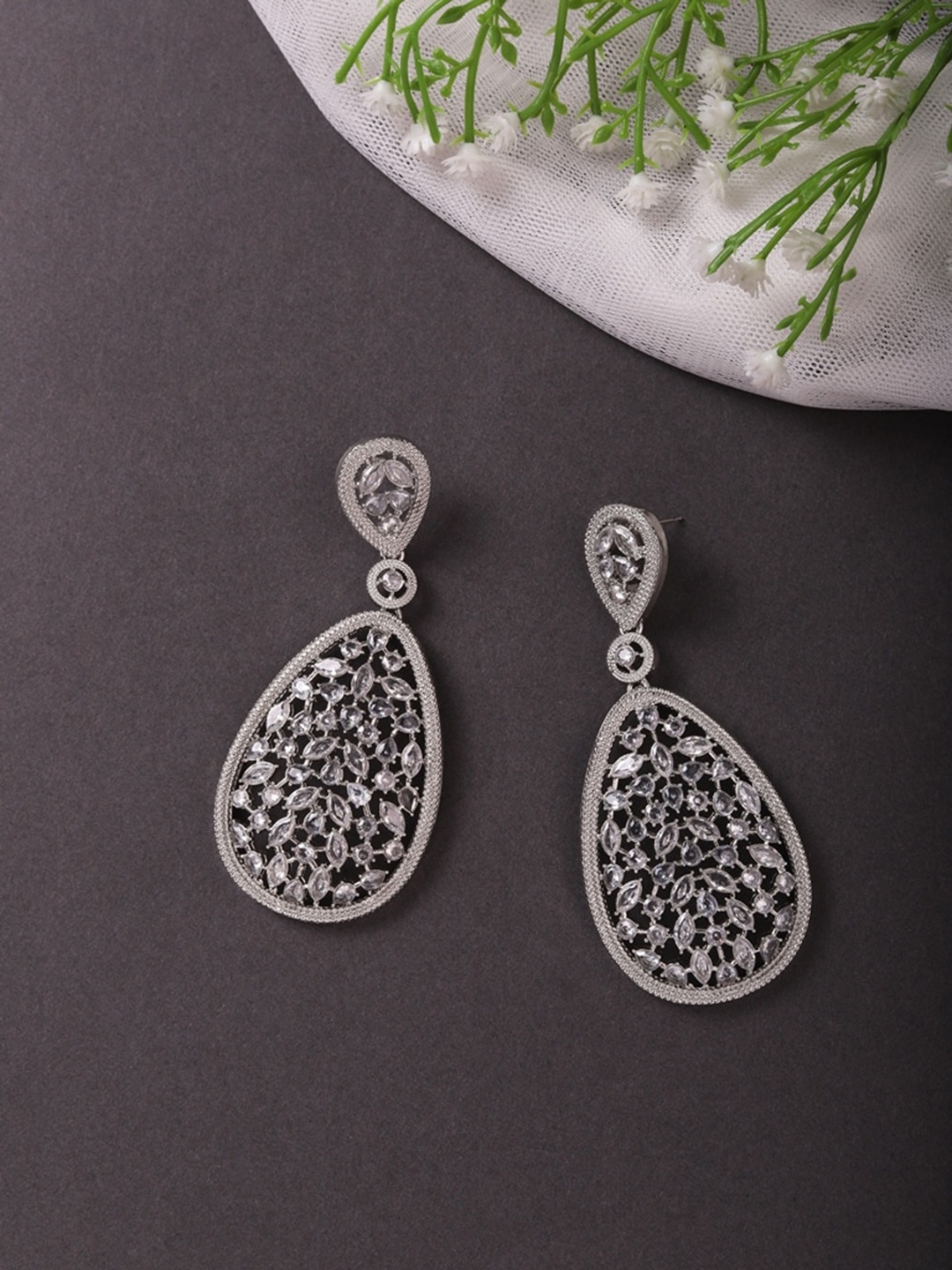 

Cierra Silver Plated Oval Shape Kundan Studded Drop Earrings