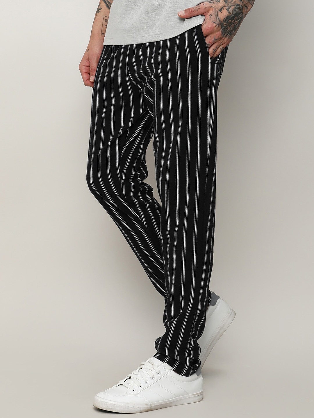 

Campus Sutra Men Striped Mid-Rise Cotton Track Pants, Black