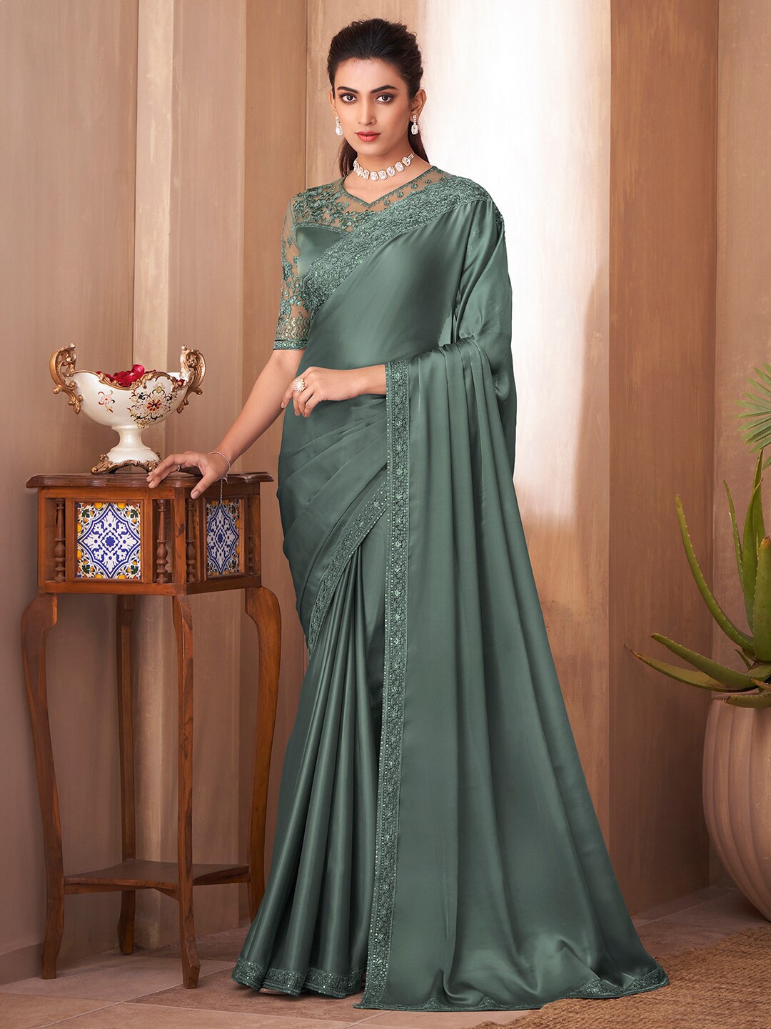 

Saree mall Sea Green Sequinned Embroidered Border Satin Saree