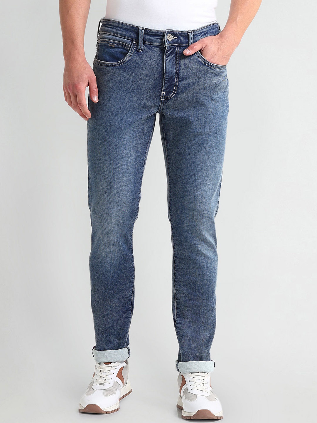 

Arrow Sport Men Slim Fit Mid Rise Clean Look Heavy Fade Stretchable Jeans, Blue