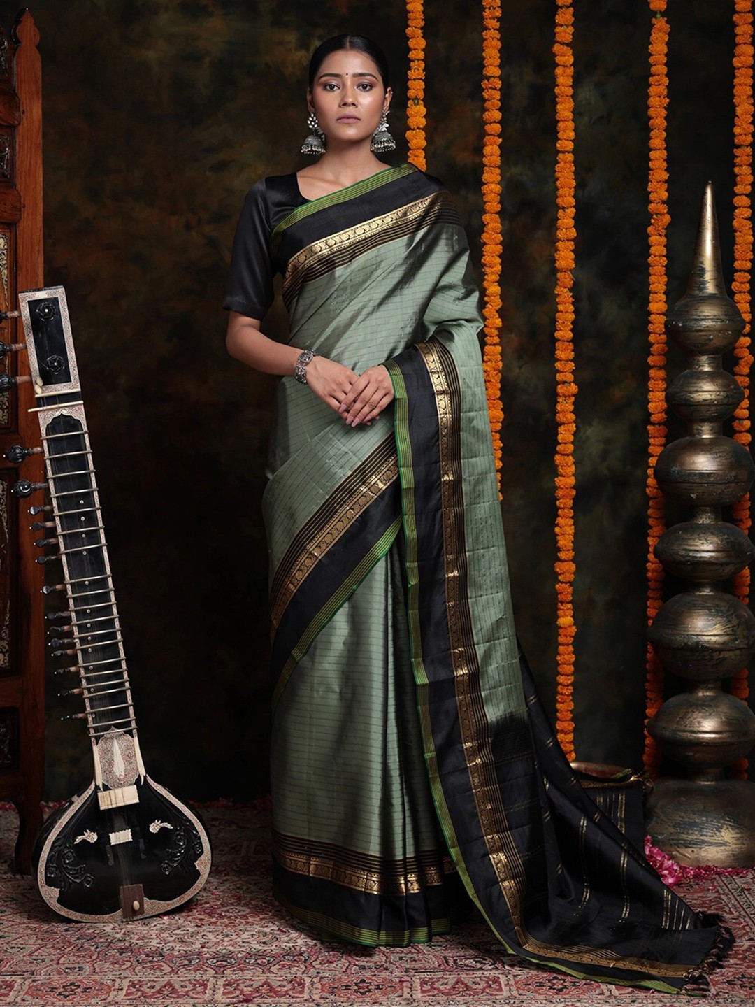

Sutra Art of Clothing Woven Design Zari Pure Silk Saree, Green