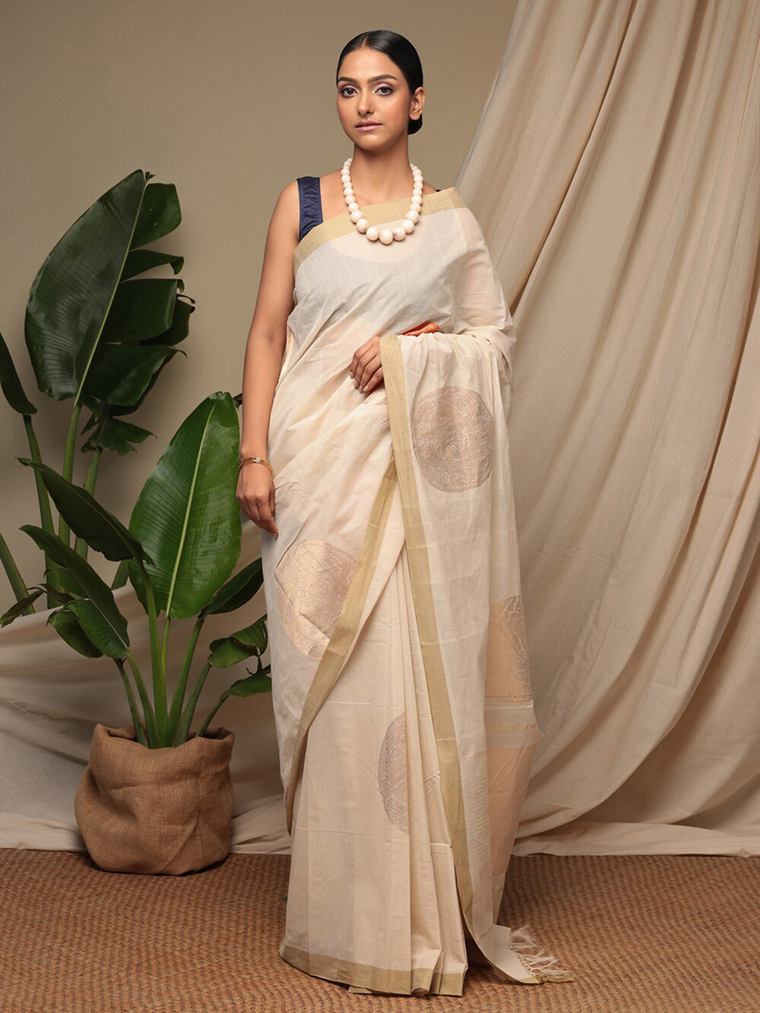 

Sutra Art of Clothing Woven Design Zari Pure Cotton Saree, Cream