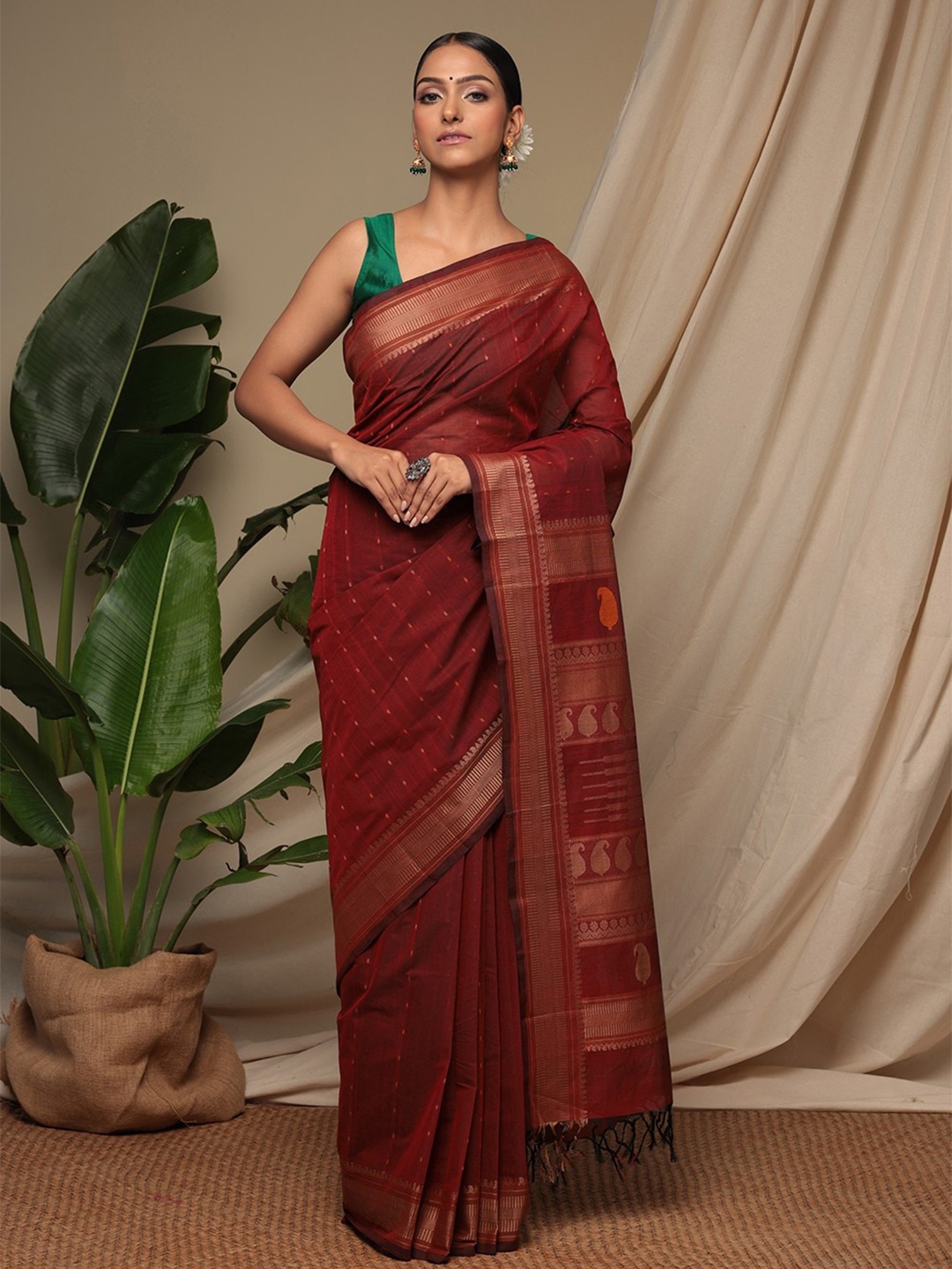 

Sutra Art of Clothing Woven Design Zari Pure Cotton Saree, Maroon