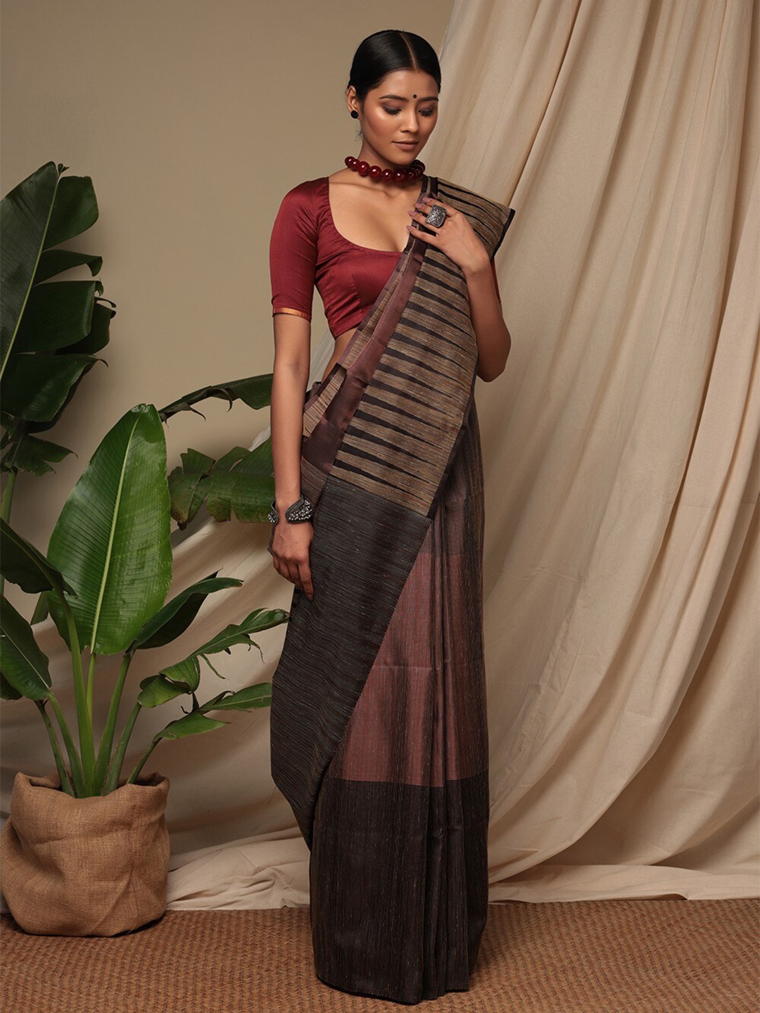 

Sutra Art of Clothing Striped Sequinned Pure Silk Saree, Brown