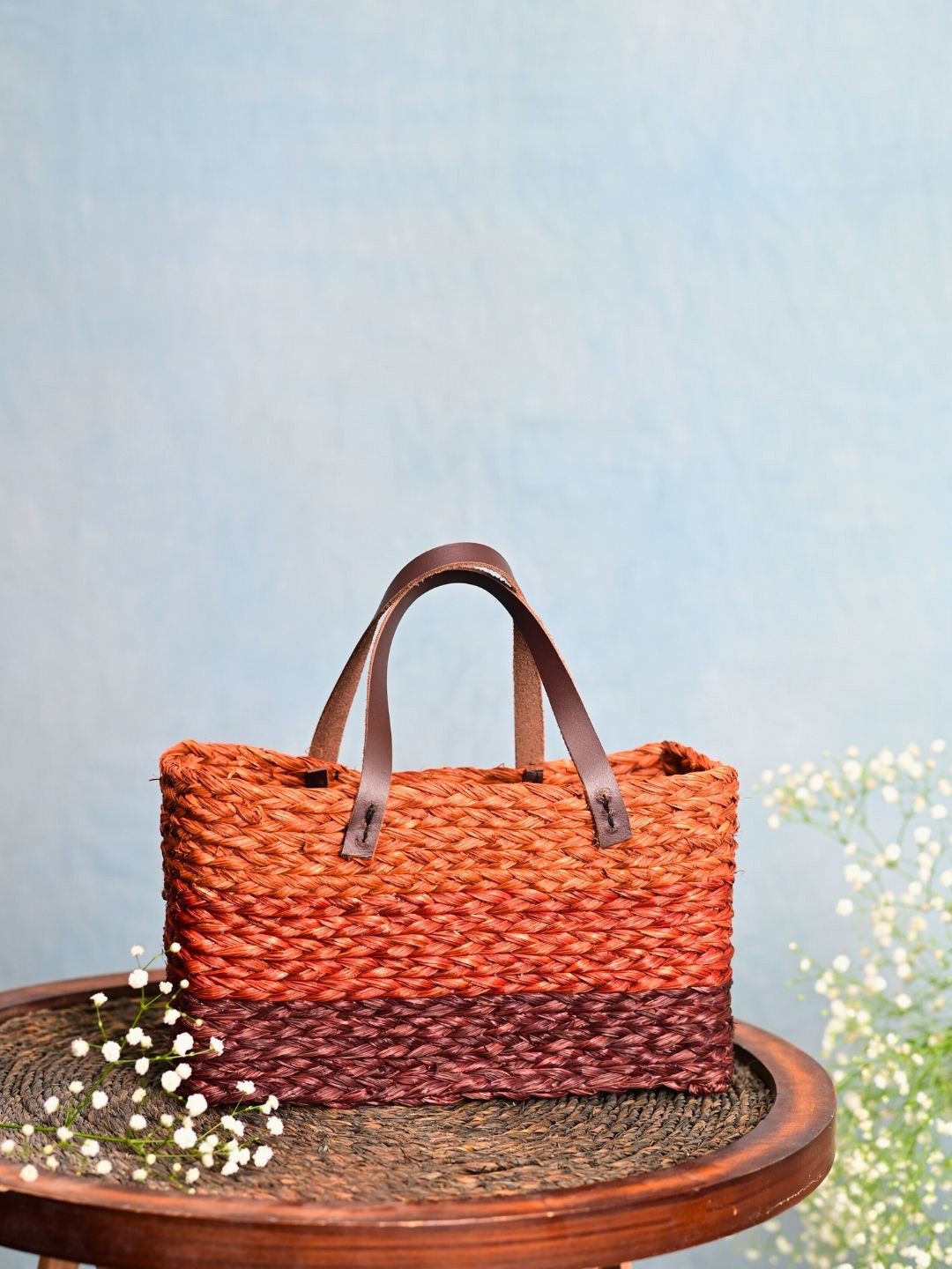 

KADAM HAAT Self Design Structured Handheld Bag, Orange
