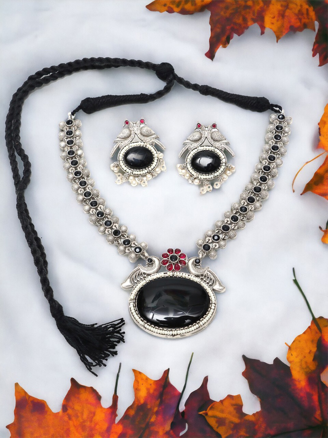 

Ozanoo Silver Plated Artificial Stones Necklace and Earrings