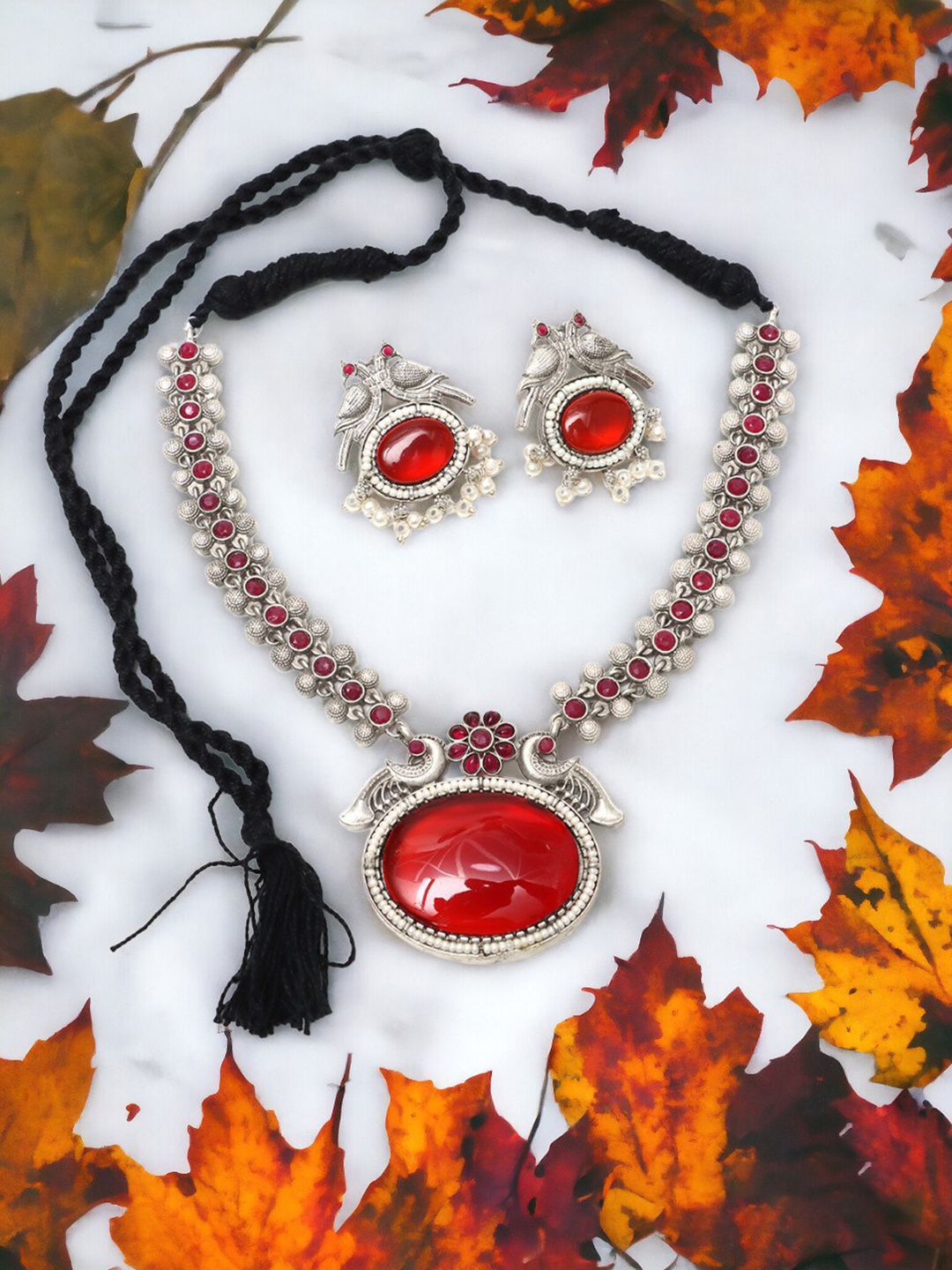 

Ozanoo Silver Plated Artificial Stones Necklace and Earrings