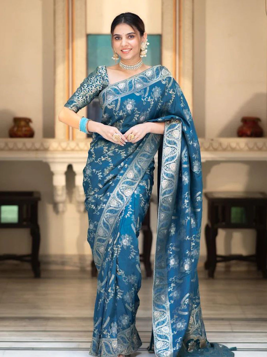 

Mitera Blue & Silver toned Ethnic Motifs Woven Design Zari Art Silk Saree
