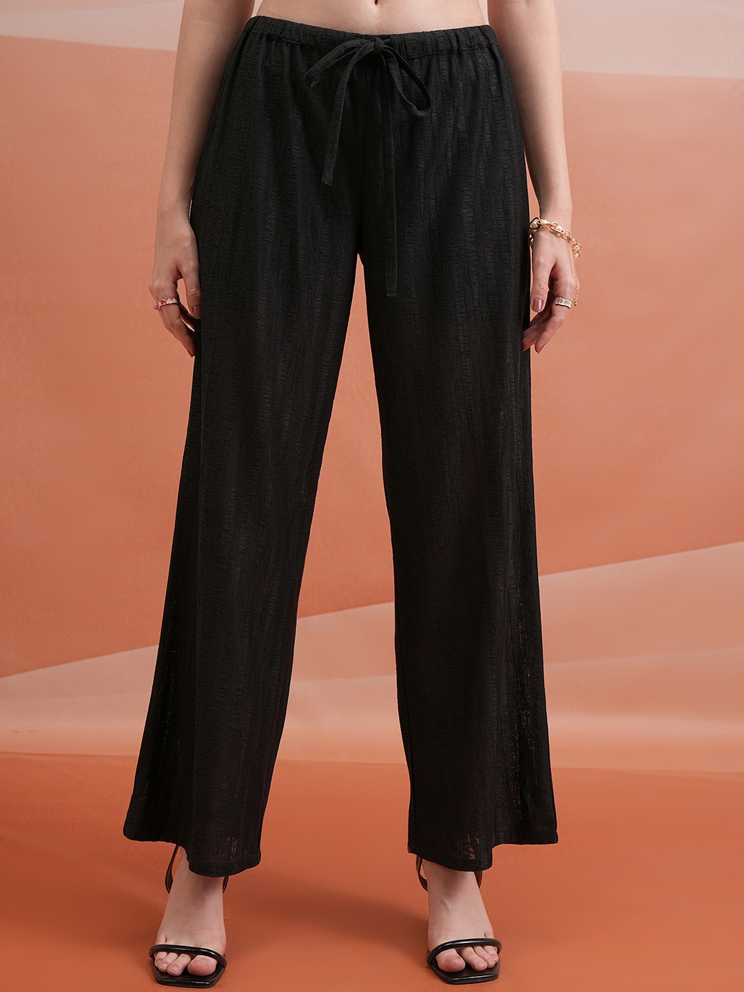 

Tokyo Talkies Women Black Textured Flared Parallel Trousers