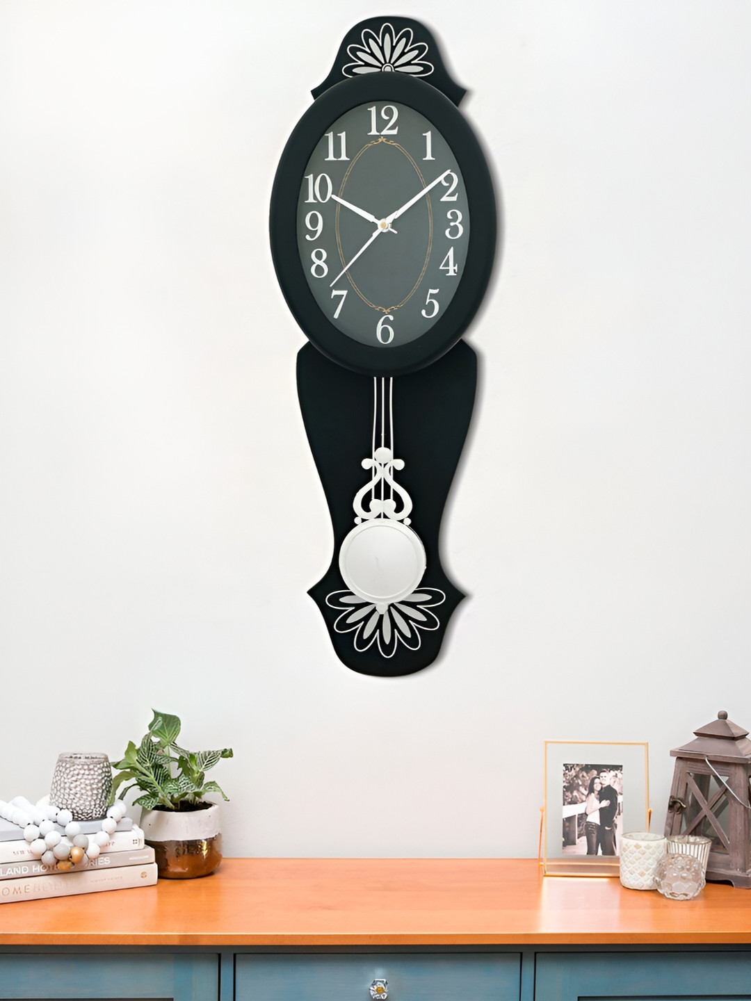 

Craft Smith Black Oval Shaped Analogue Contemporary Pendulum Wall Clock