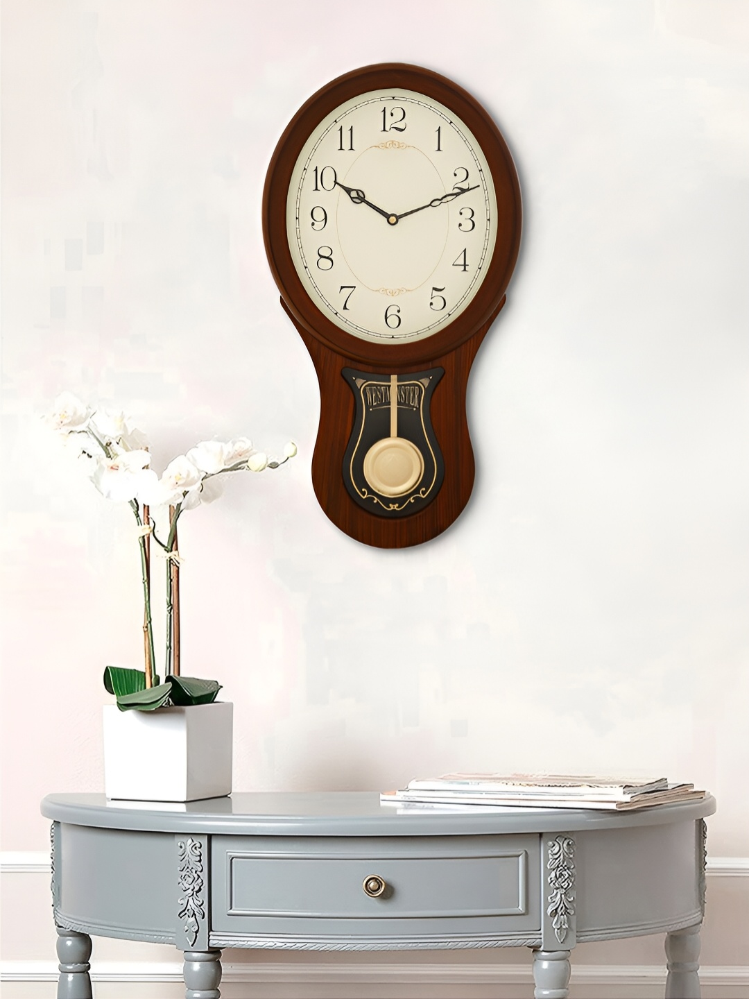 

Craft Smith Brown Round Contemporary Pendulum Wall Clock