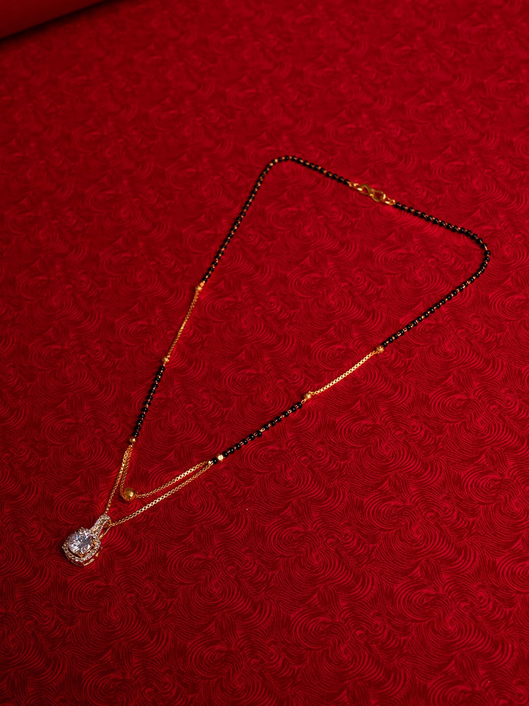 

Shoshaa Gold Plated Artificial Stones and Beads Mangalsutra
