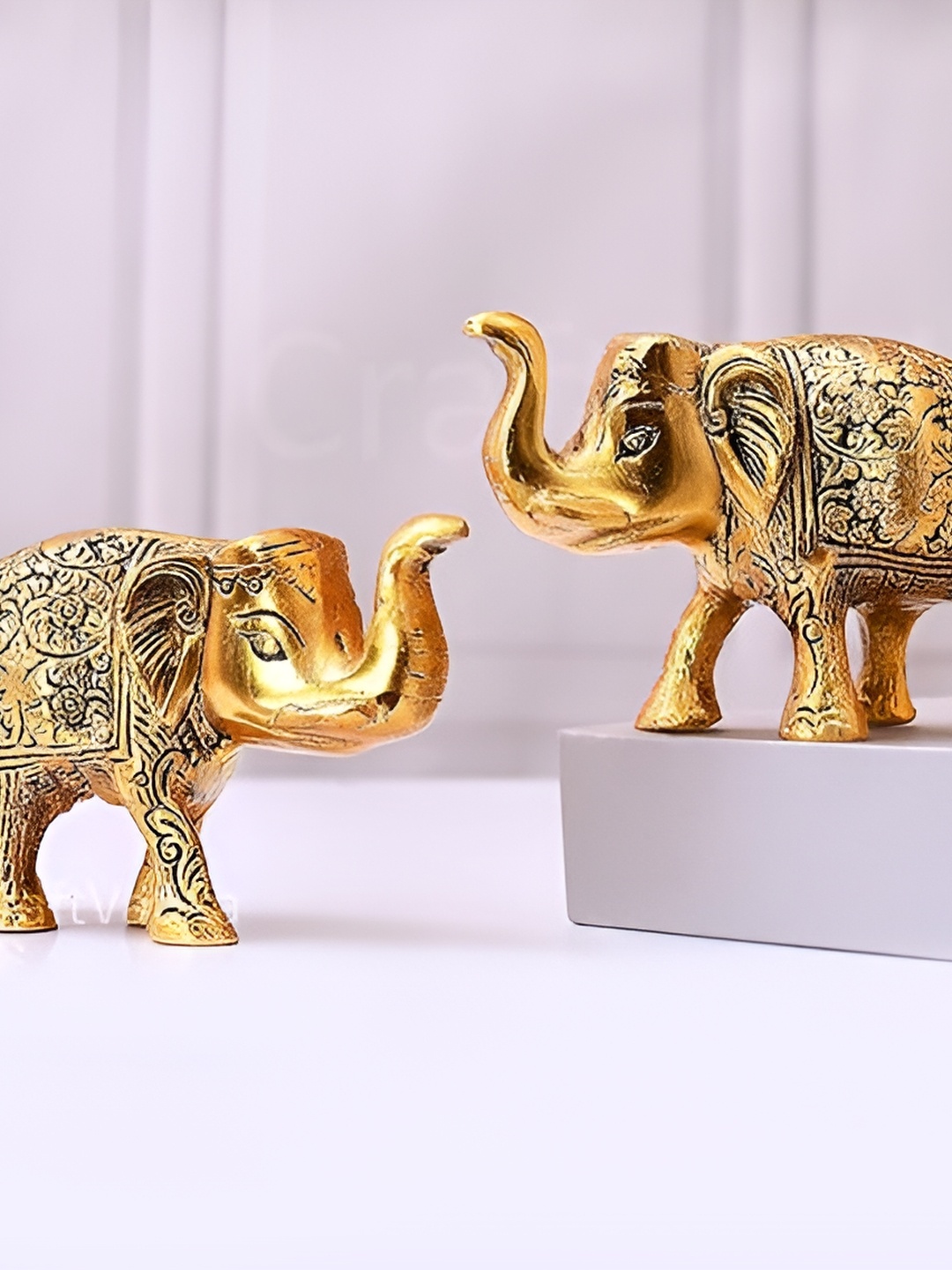 

CraftVatika Gold-Toned & Black 2 Pieces Metal Idol Showpiece