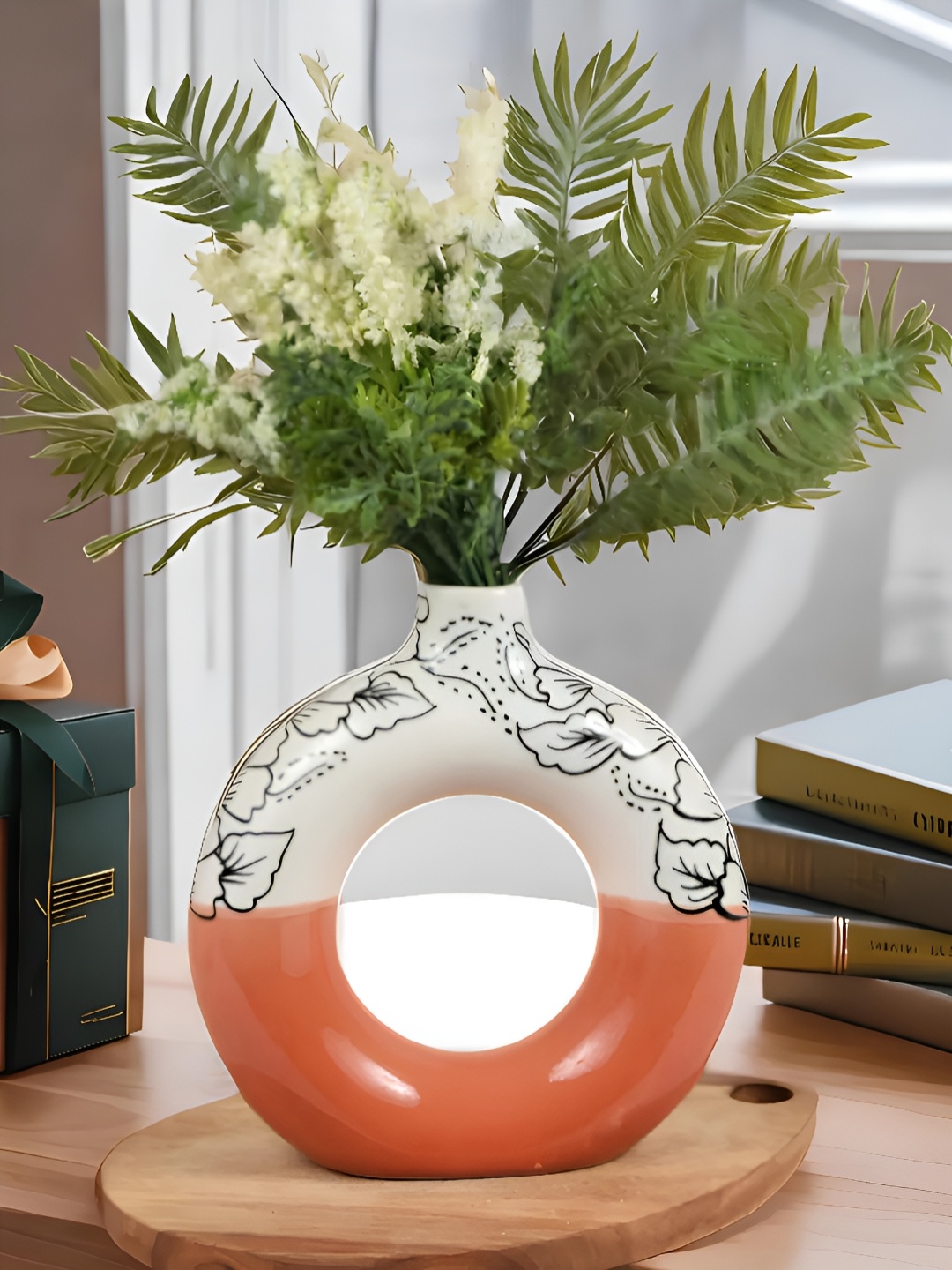 

Kaolinite Orange-Colored & White Floral Printed Donut Shaped Ceramic Vase