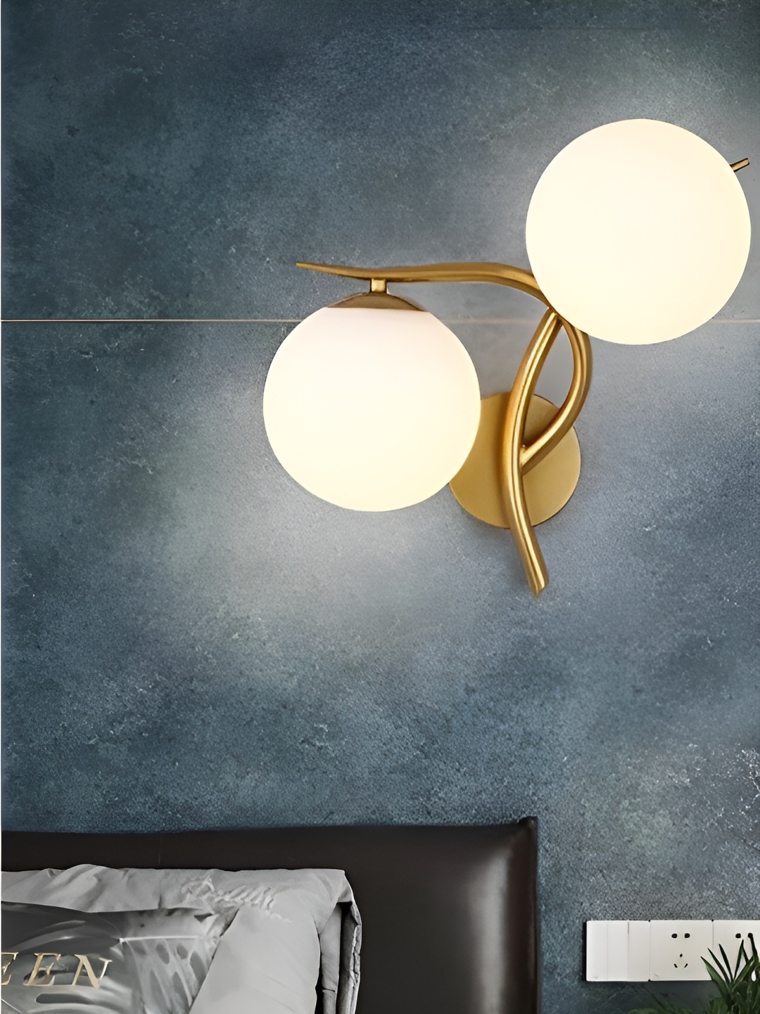 

Areezo Gold-Toned Textured Spherical Aluminium Contemporary Wall Lamp