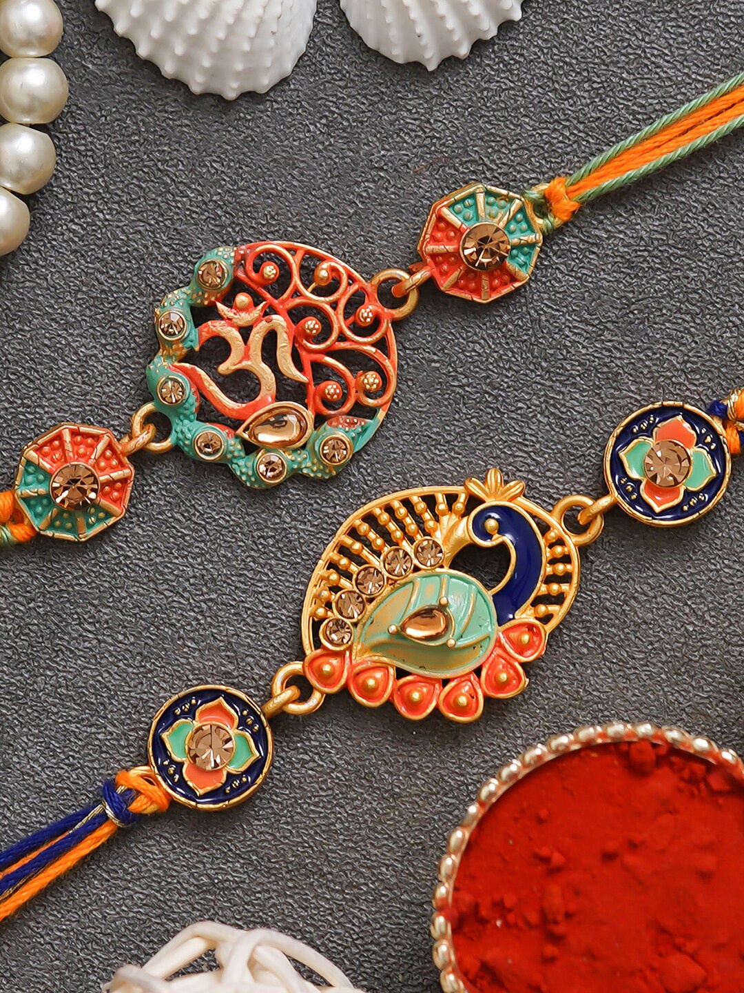 

eCraftIndia Set of 2 Religious Om Symbol and Peacock Rakhi with Roli Chawal, Orange