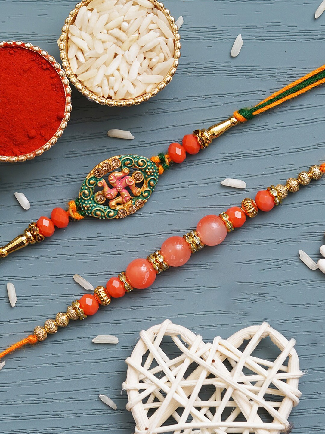 

eCraftIndia Unisex Set Of 2 Swastik & Beaded Rakhis With Roli & Chawal, Gold
