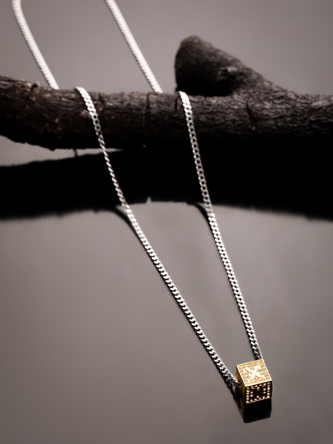

The Roadster Lifestyle Co. Men Silver-Toned X Letter Cubic Pendant With Chain