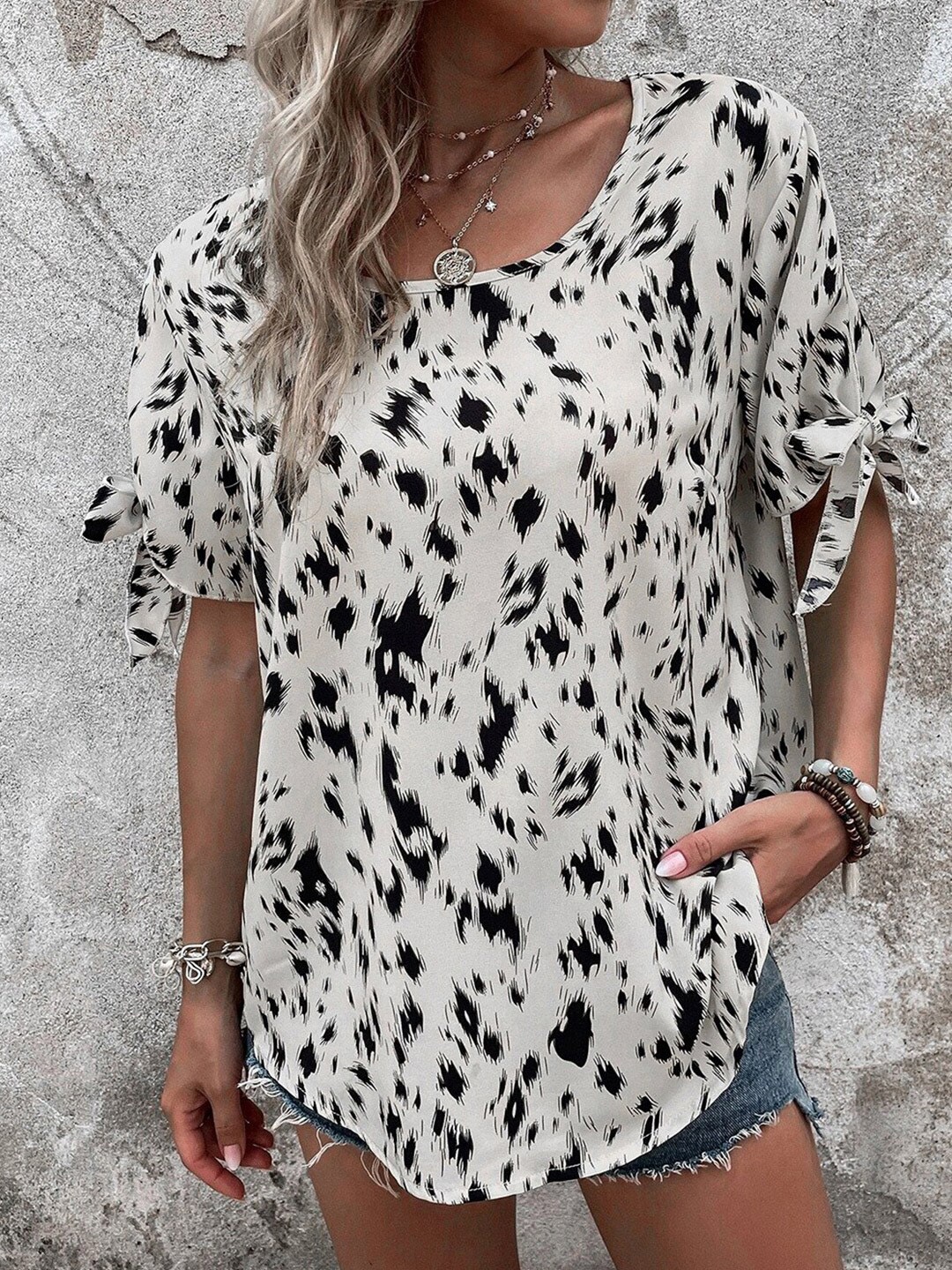 

StyleCast x Revolte Abstract Printed Flared Sleeves Top, White