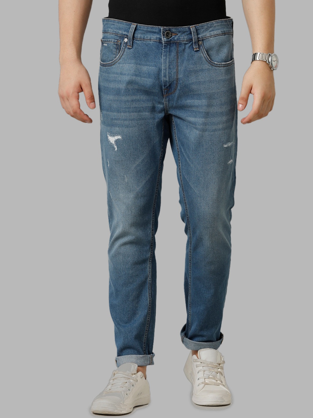 

Voi Jeans Men Mid-Rise Comfort Skinny Fit Mildly Distressed Light Fade Stretchable Jeans, Blue