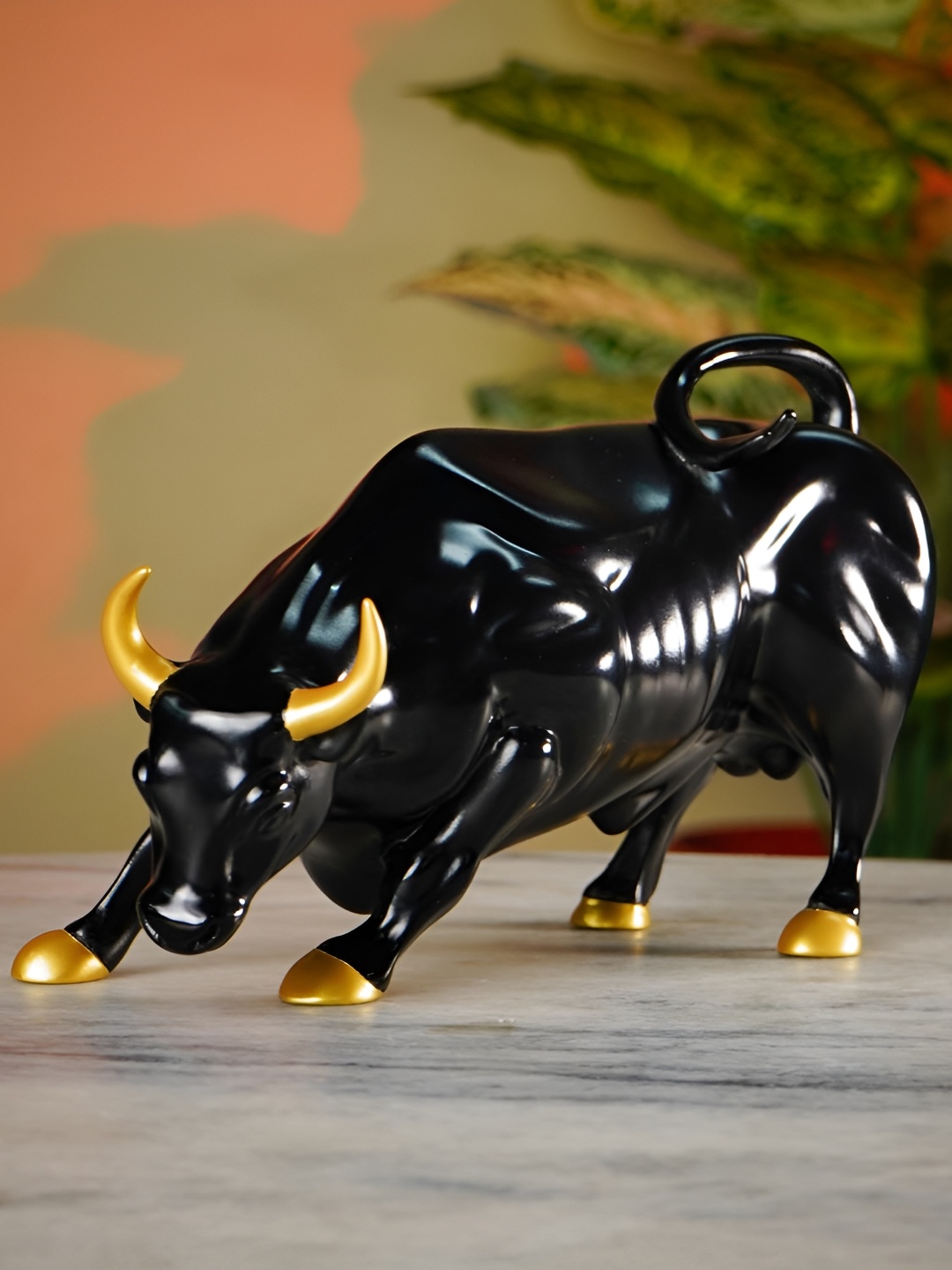 

Artarium LLP Black & Gold Toned Charging Bull Figurine Showpiece