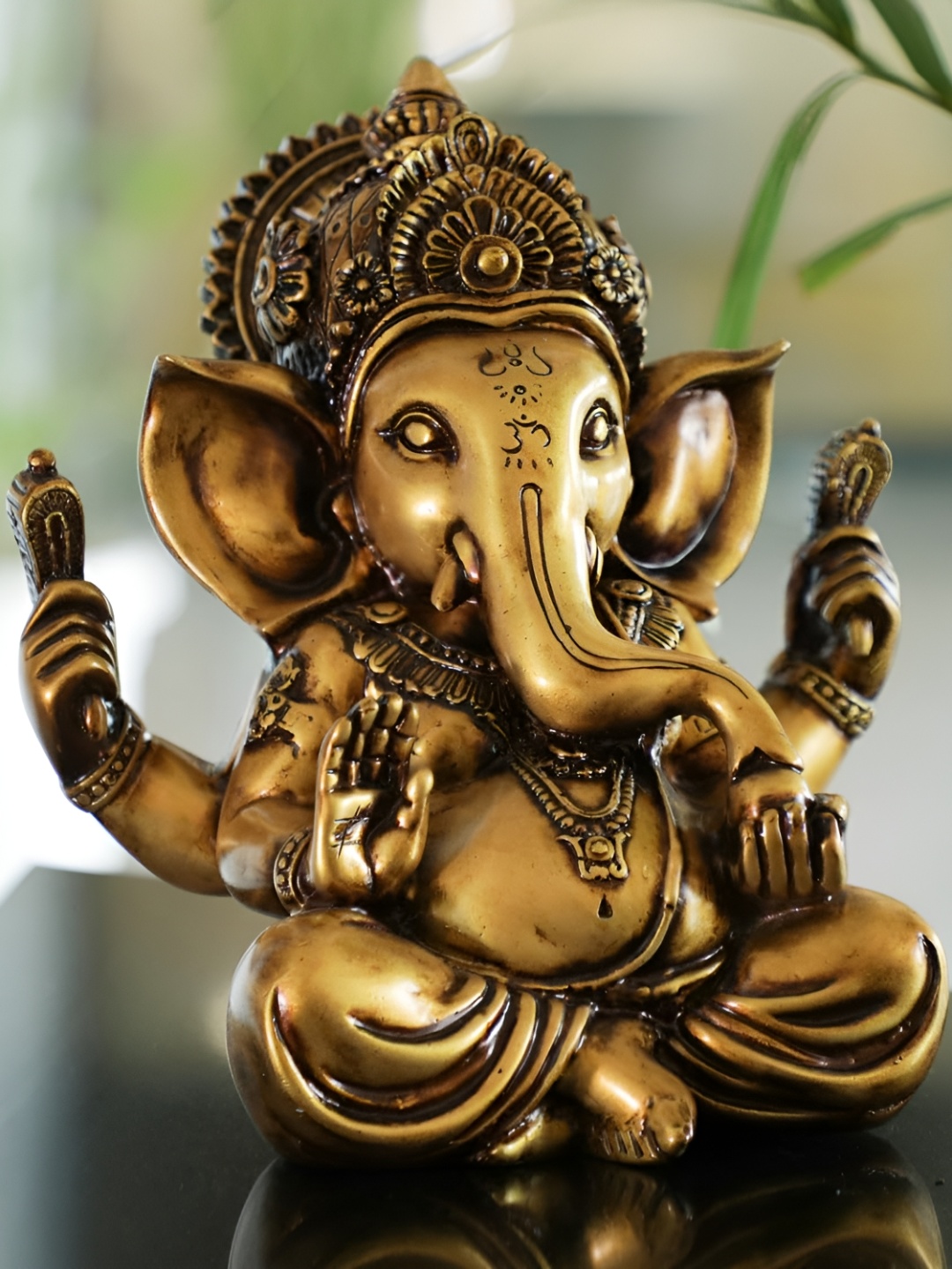 

Artarium LLP Gold Toned Religious Vighnaharta Ganesha Idol Showpiece