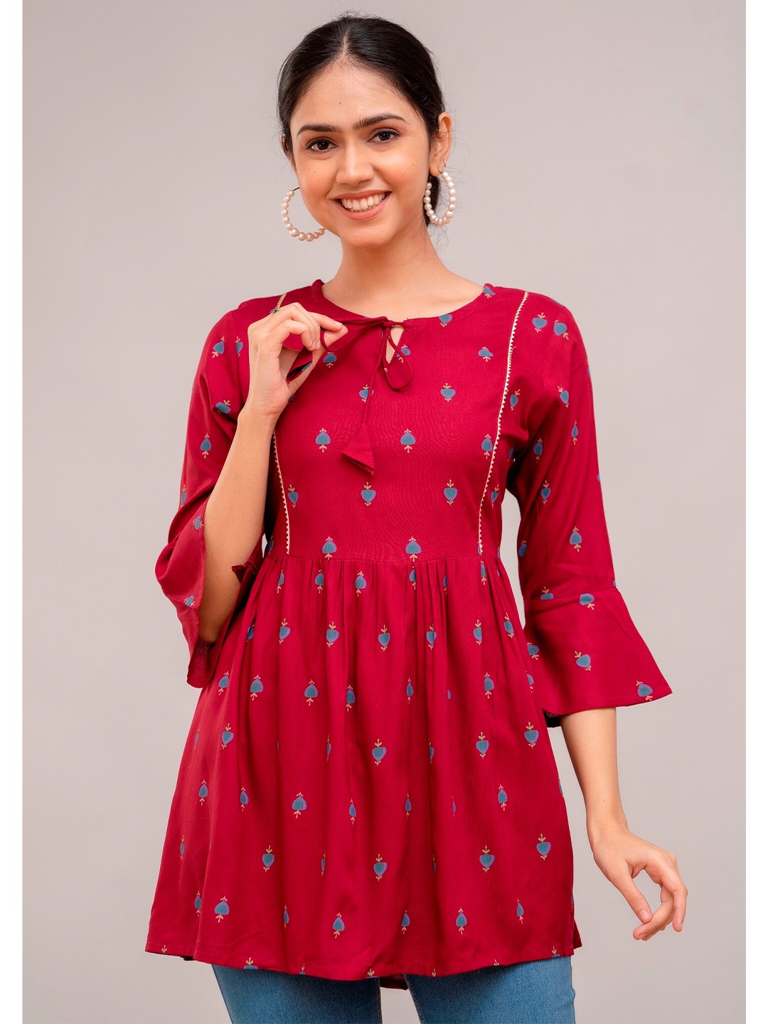 

Prakhya Floral Printed Tie-Up Neck Bell Sleeves Straight Kurti, Maroon