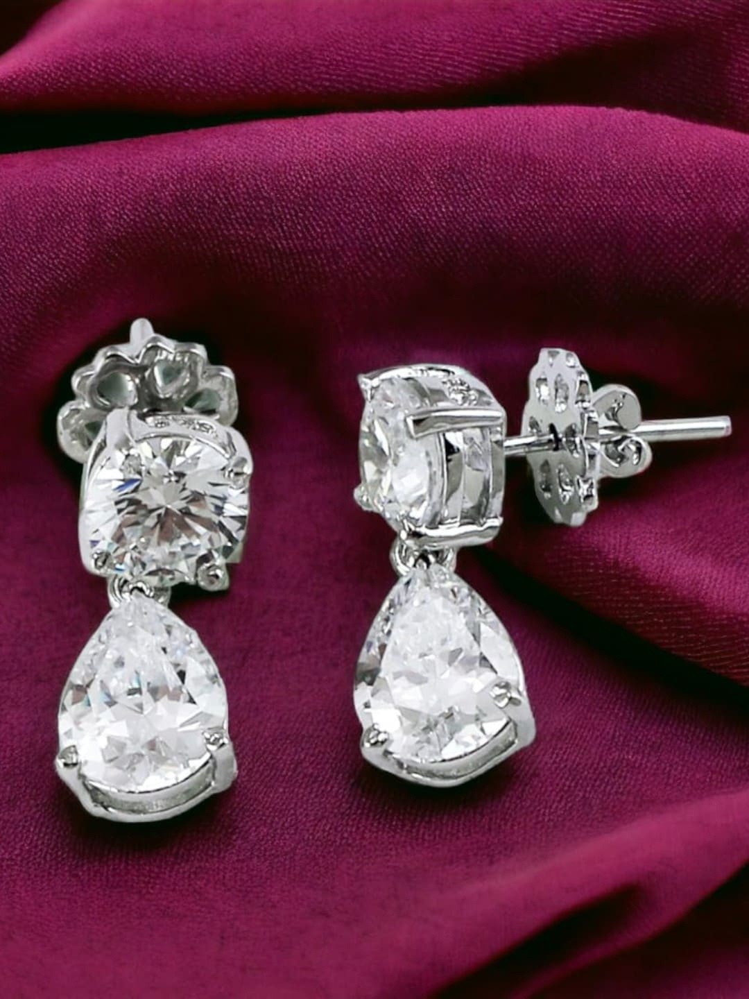 

Taraash 92.5 Sterling Silver Cubic Zirconia Studded Teardrop Shaped Studs Earrings