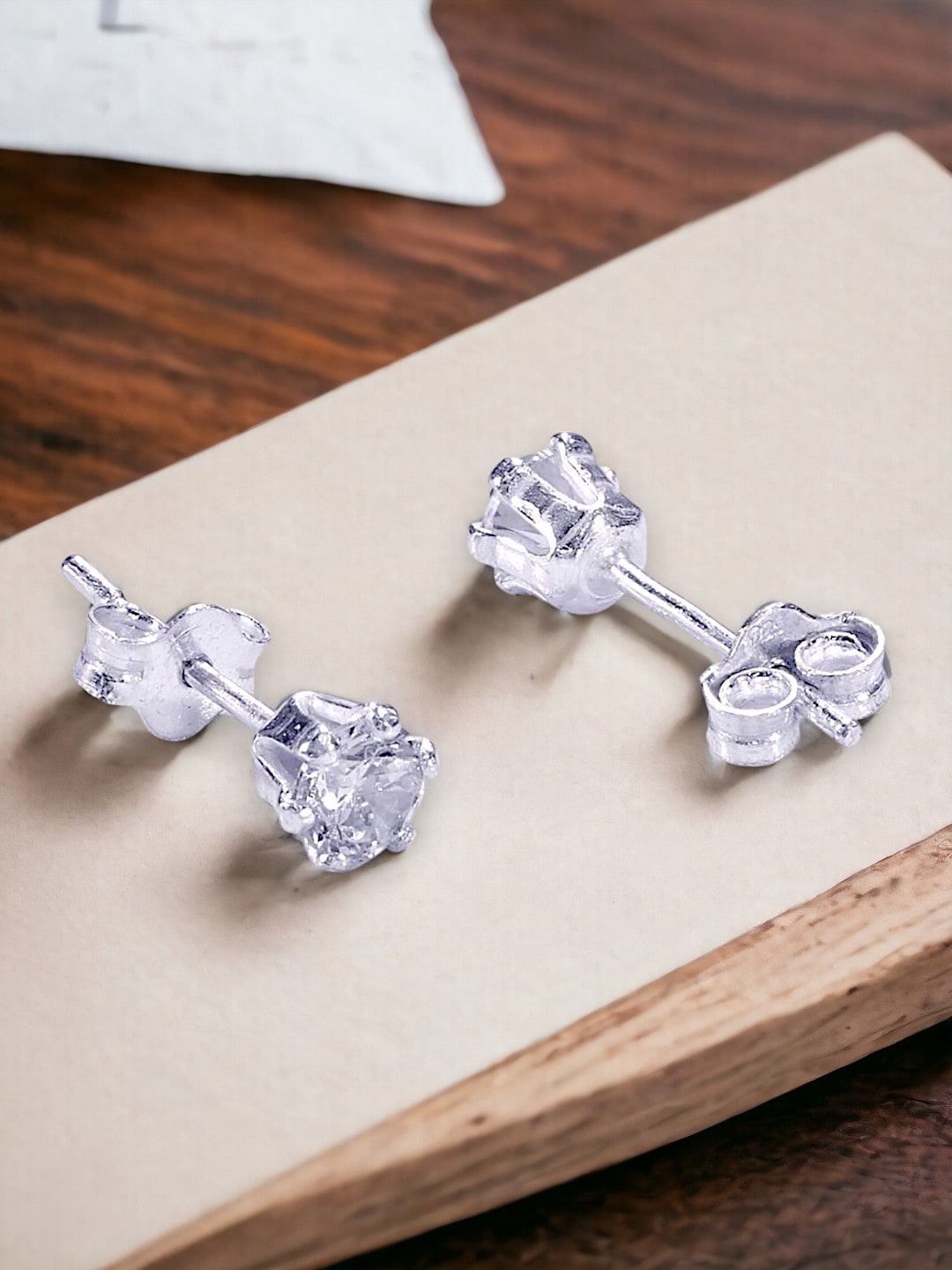 

Taraash 92.5 Sterling Silver Cubic Zirconia Studded Diamond Shaped Studs Earrings
