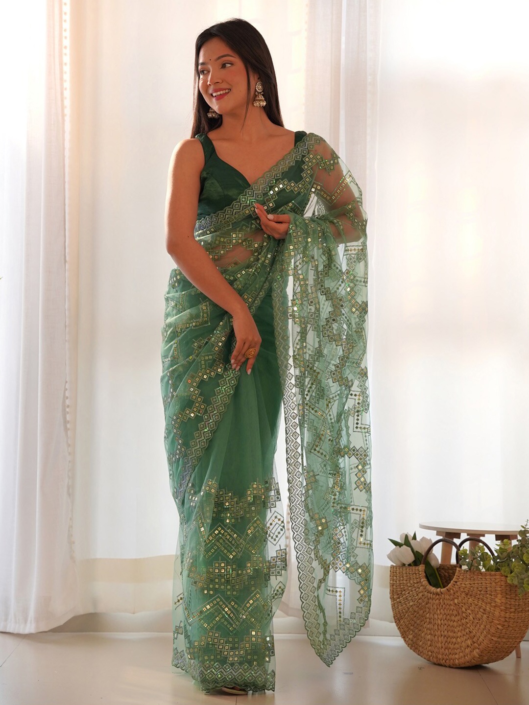 

Saree mall Sequined Embellished Net Saree, Green