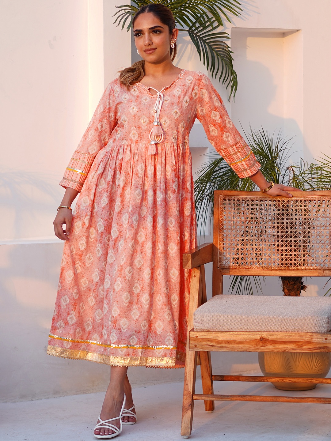 

Libas Ethnic Motifs Printed Tie-Up Neck Cotton Fit and Flare Ethnic Dress, Peach