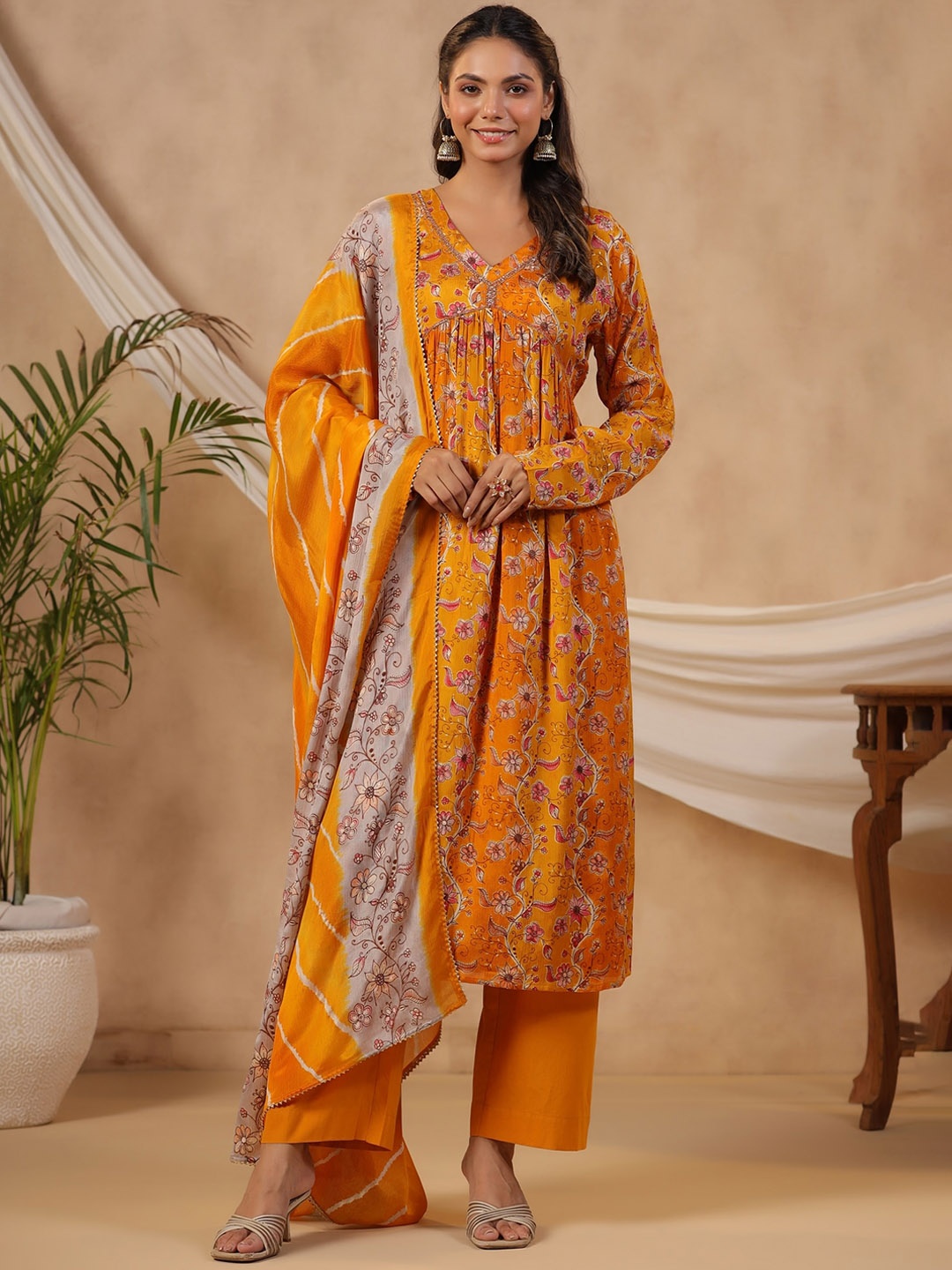 

KALINI Women Floral Printed Regular Beads and Stones Kurta with Trousers & With Dupatta, Mustard