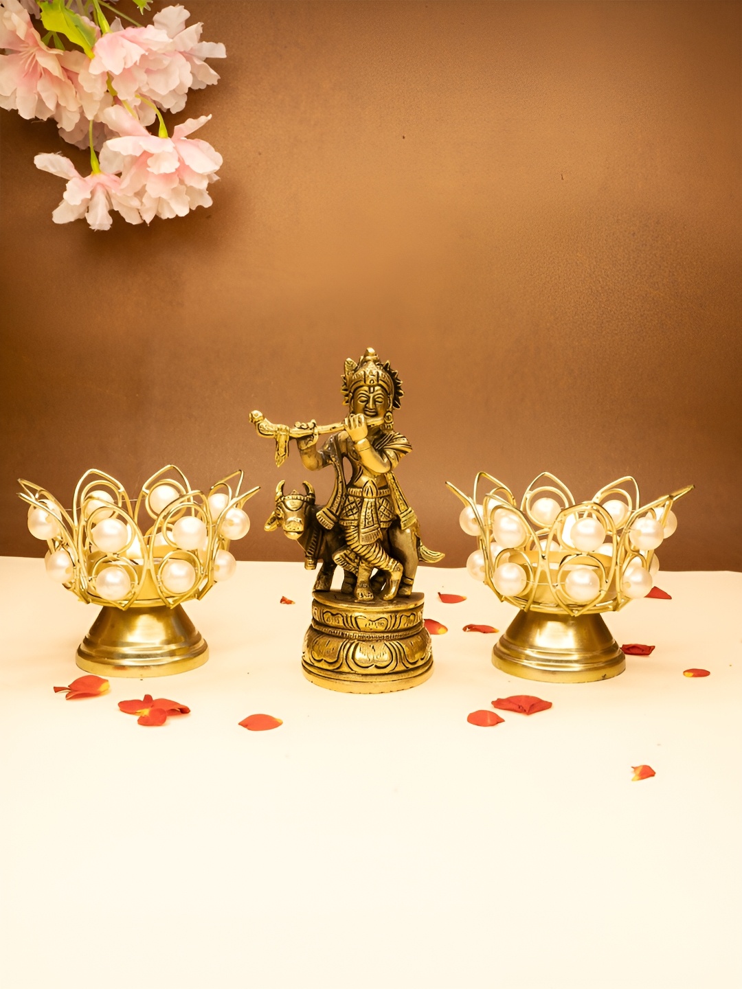 

Ekhasa Gold Toned 3 Pieces Textured Lord Krishna Idol & Tealight Candle Holders