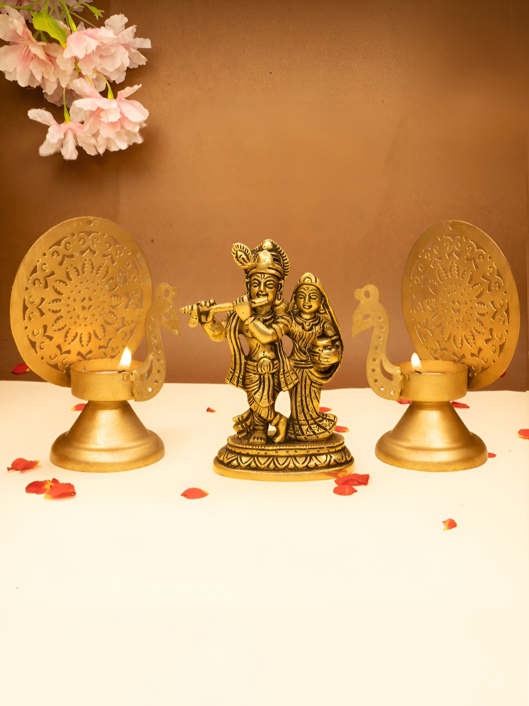 

Ekhasa Gold Toned 3 Pieces Textured Radha Krishna Idol & Tealight Candle Holders