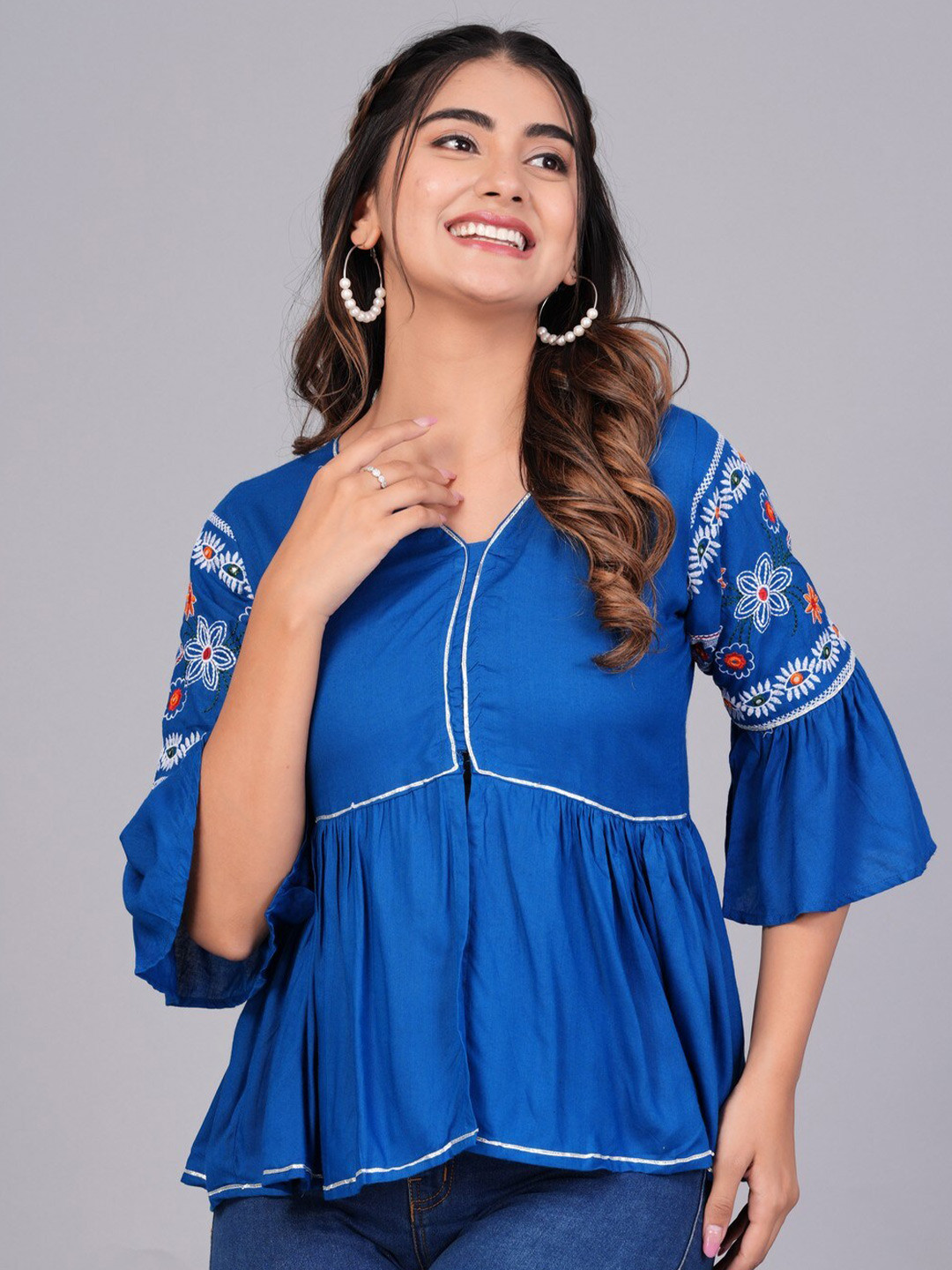 

ANUTTARA FASHIONS Floral Embroidered Bell Sleeve Peplum Top, Blue