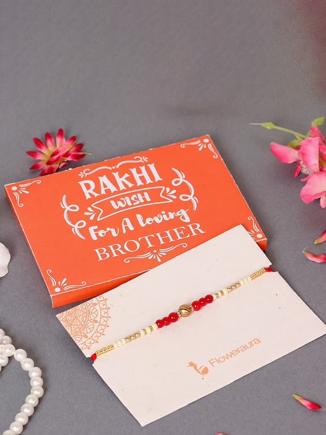 

Floweraura Pearl Rakhi with Roli & Chawal, Red